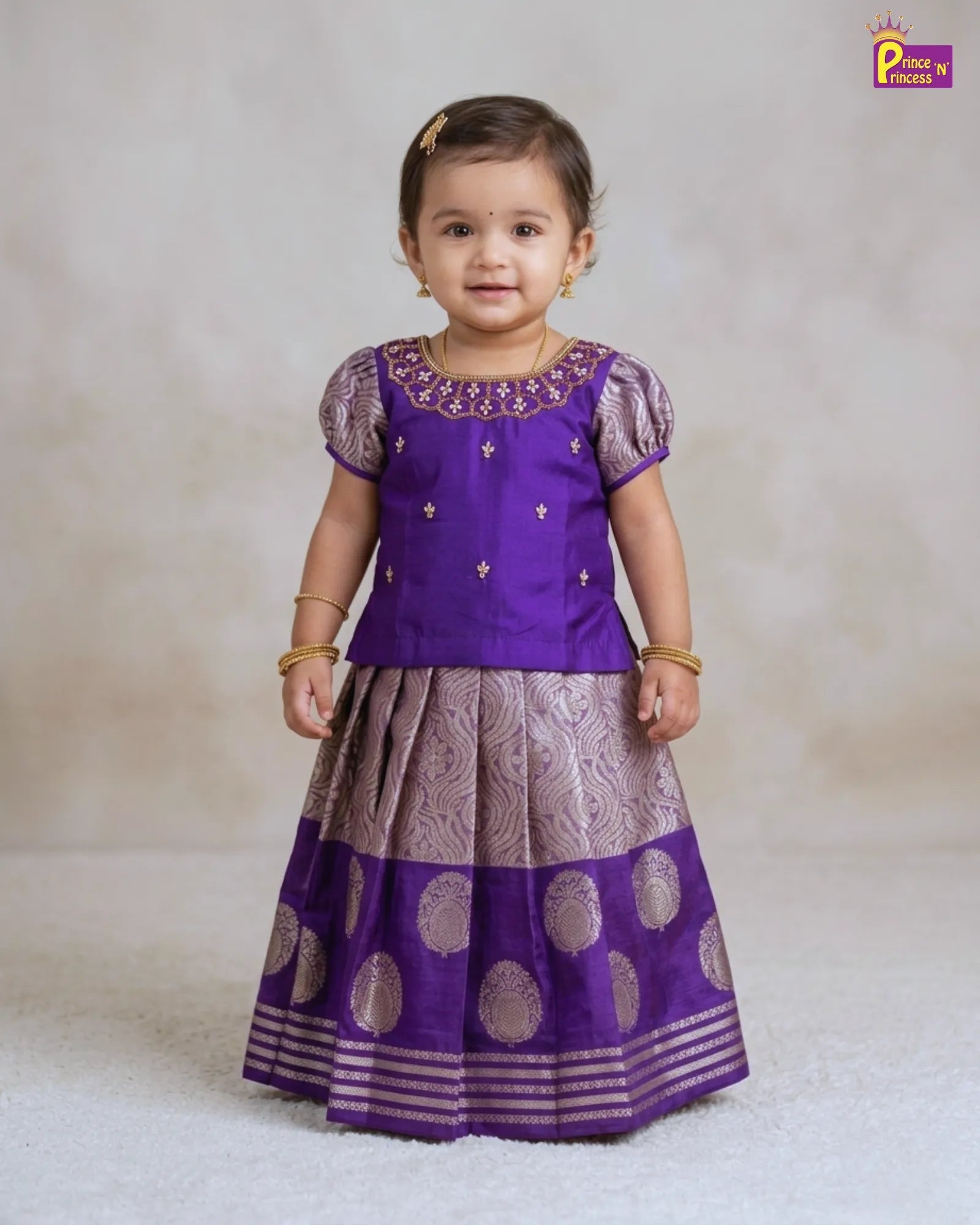 girl wearing Festival Pattu Pavadai Boat Neck Aari Work Purple Pattu