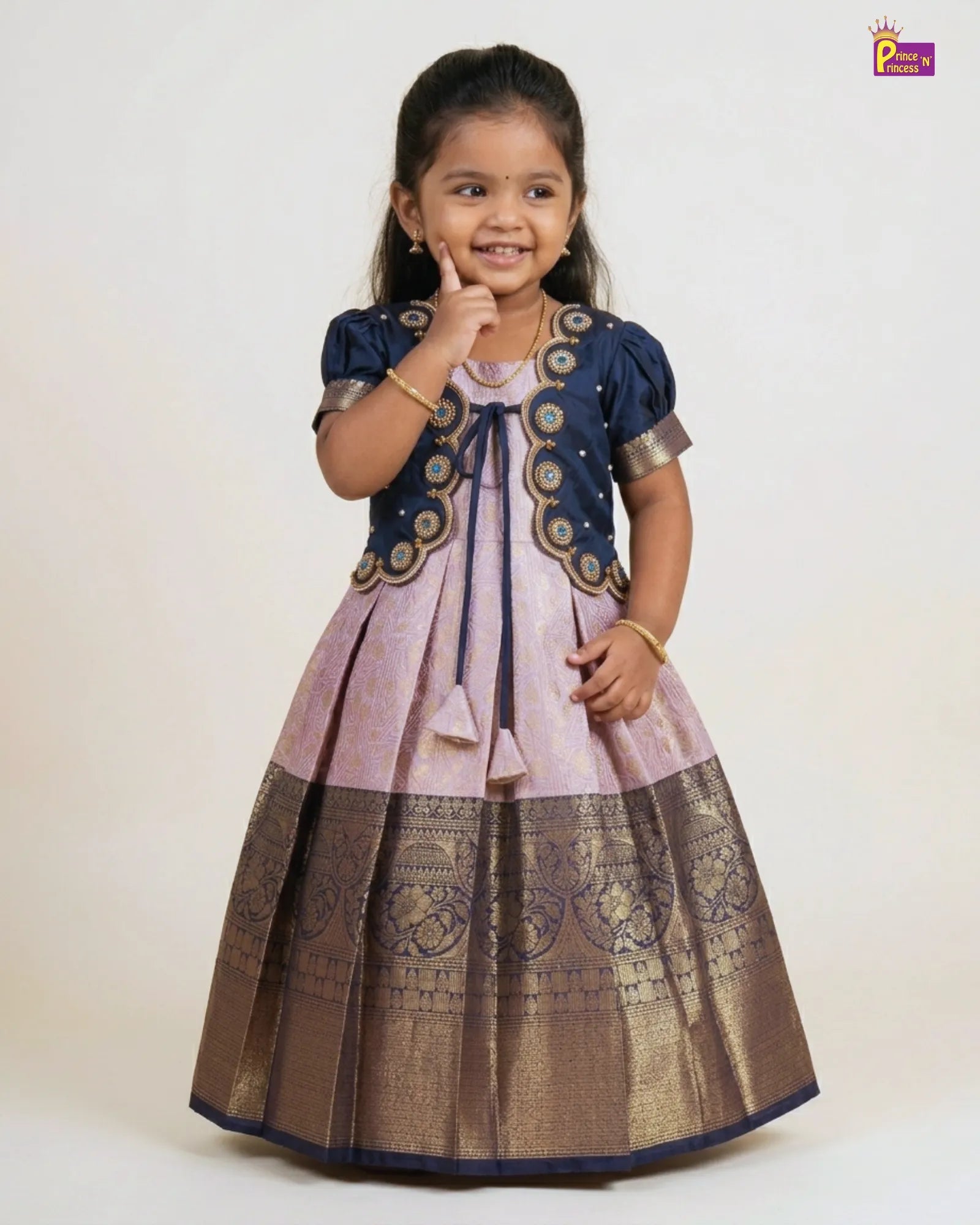 Young girl wearing a traditional outfit with a white background