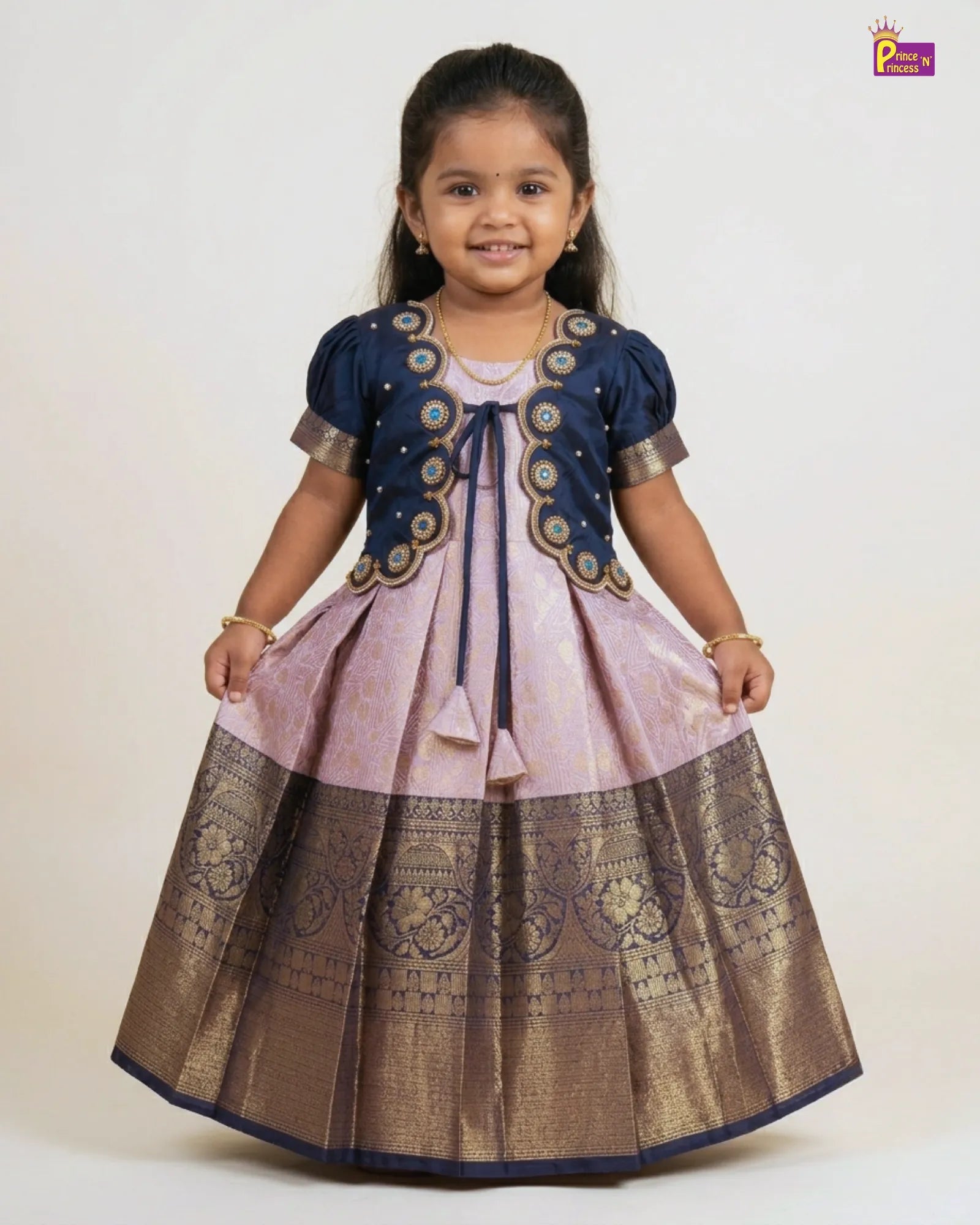 Young girl wearing a traditional outfit with a white background