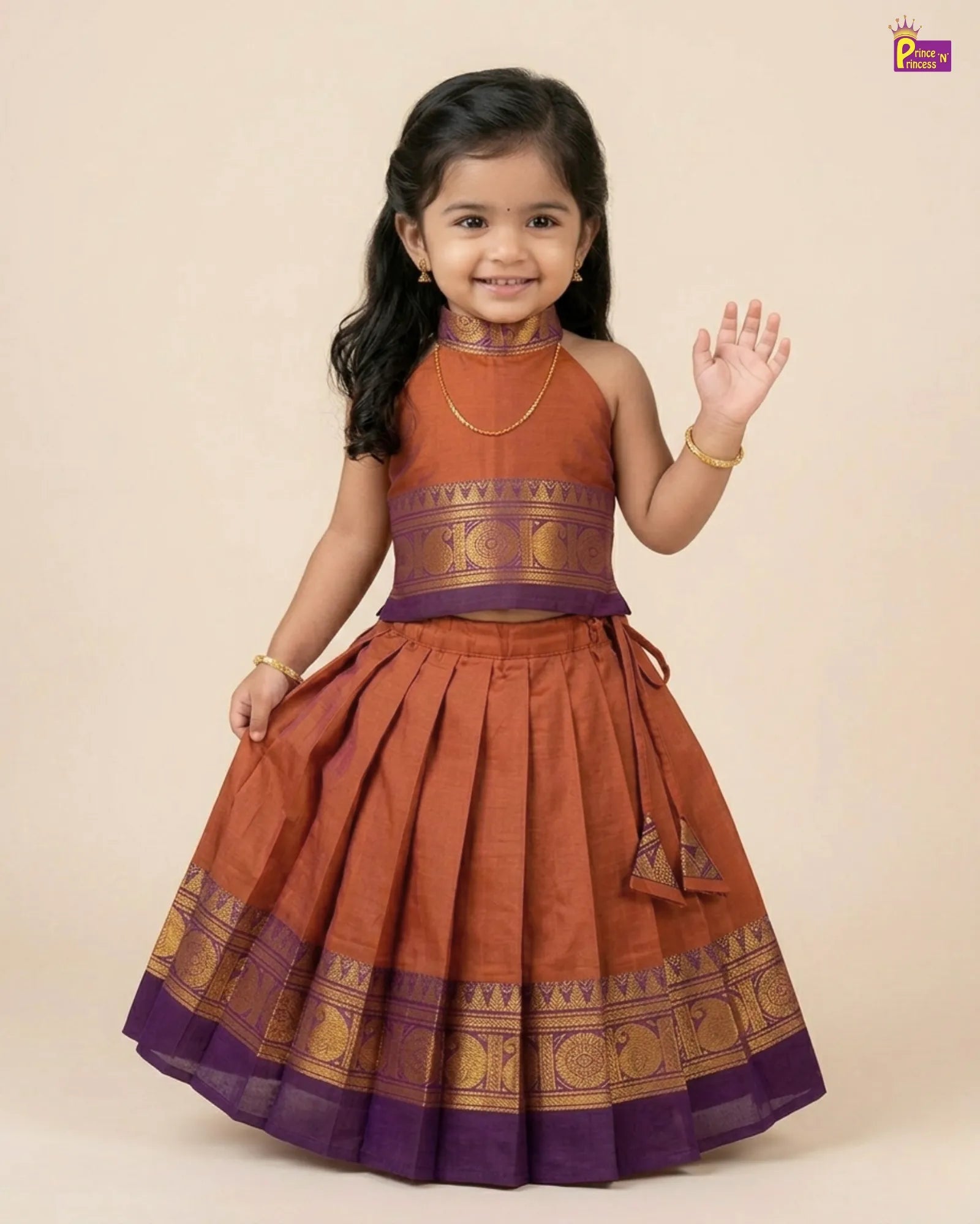 Young girl wearing a traditional brown and purple dress on a beige background