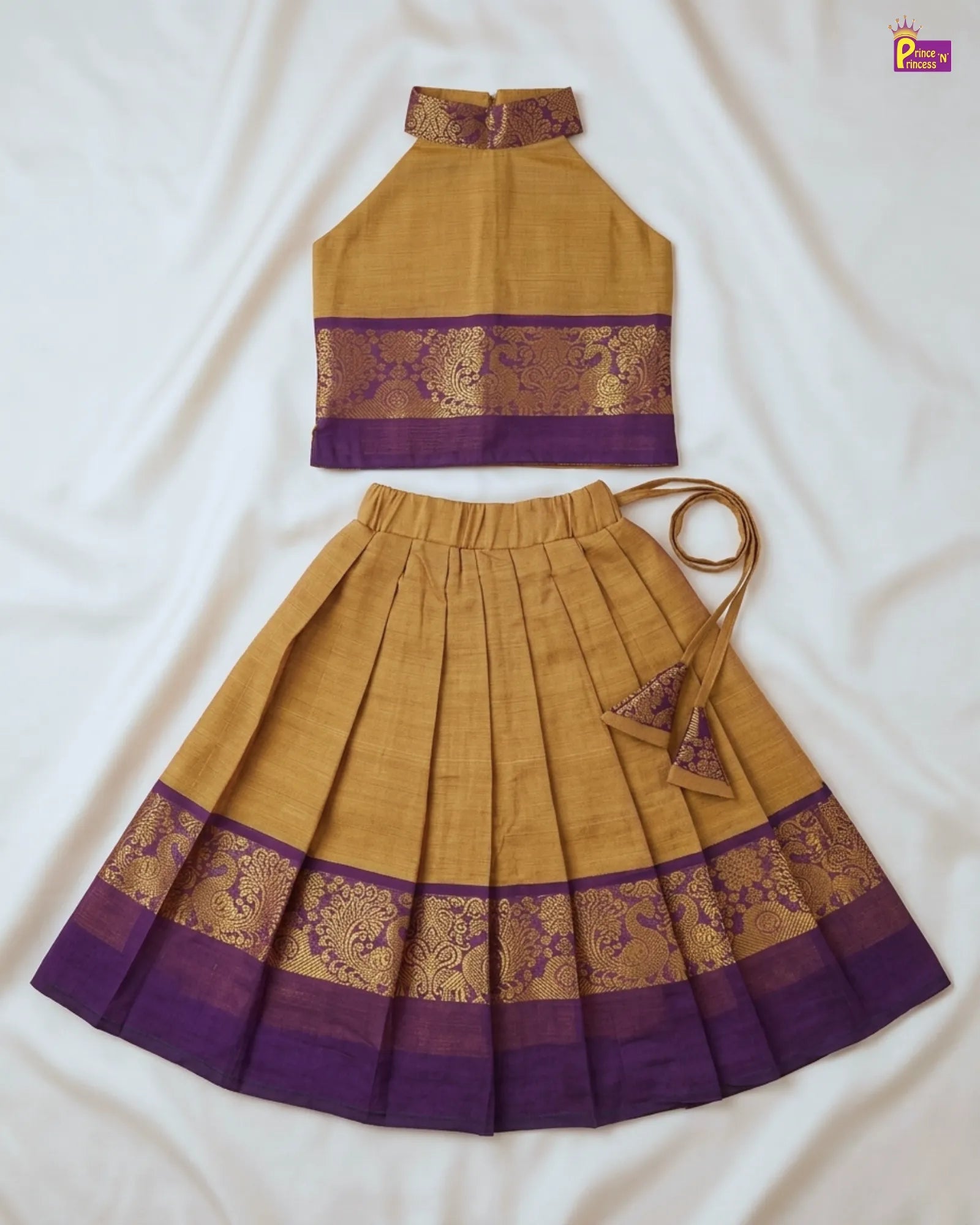 Mustard yellow and purple traditional outfit with floral patterns on a white background