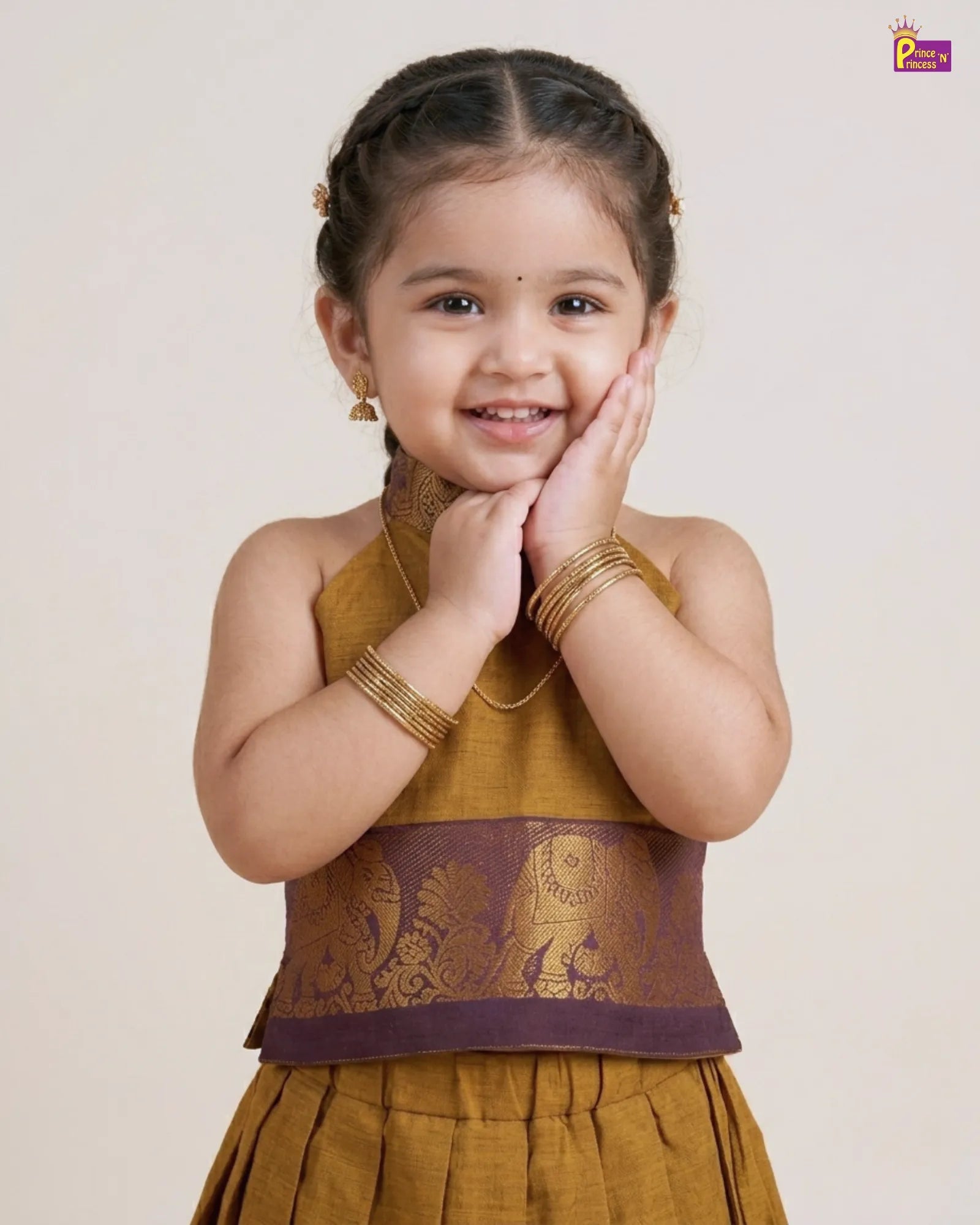 Young girl wearing a traditional outfit with a plain background