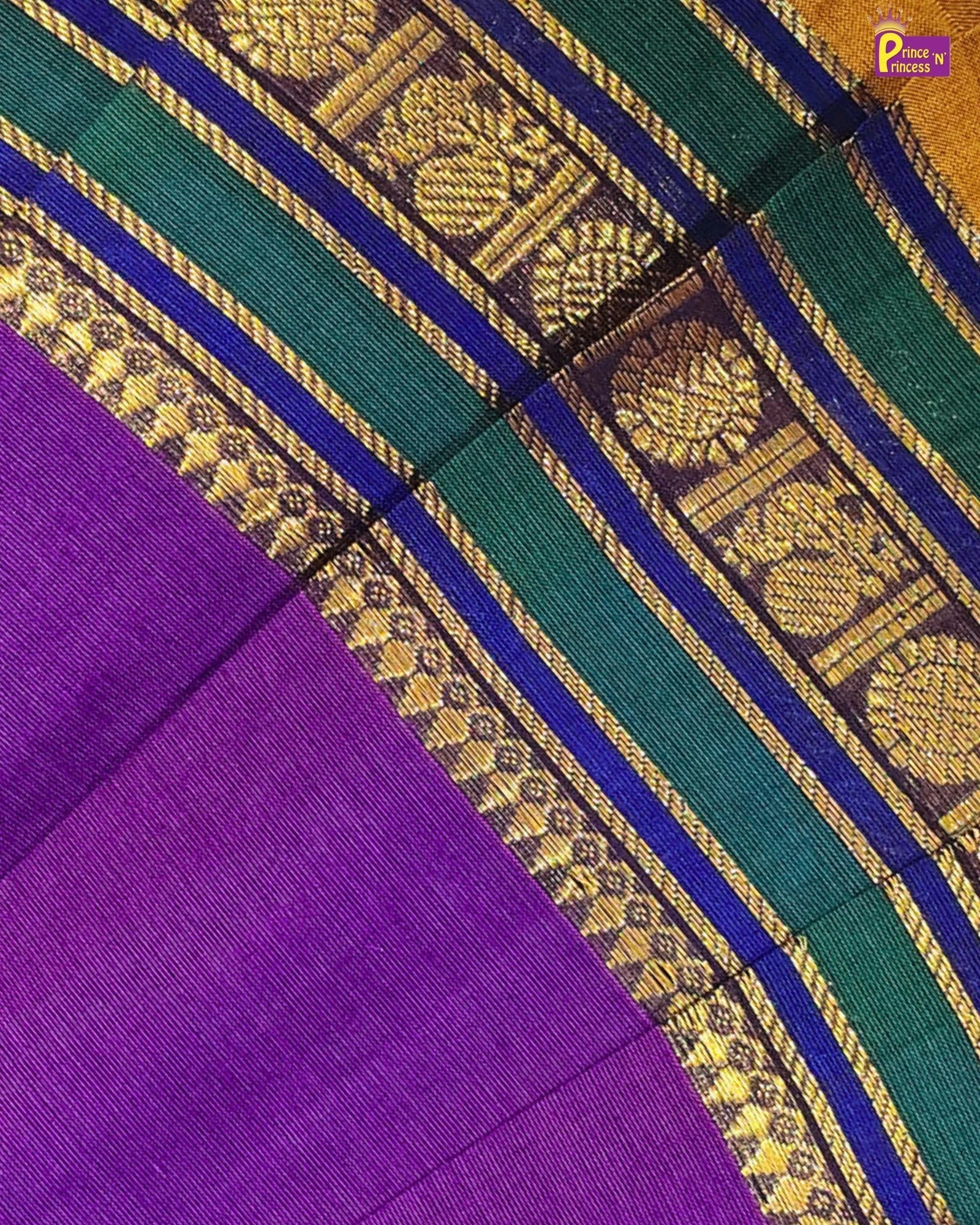 Close-up of a purple and green fabric with gold border