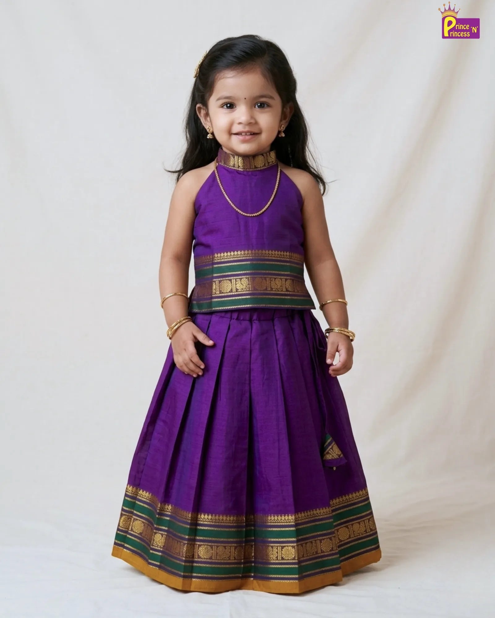 Girl in purple Chettinad pattu pavadai cotton halter neck set with gold temple zari border by Prince N Princess kids ethnic wear