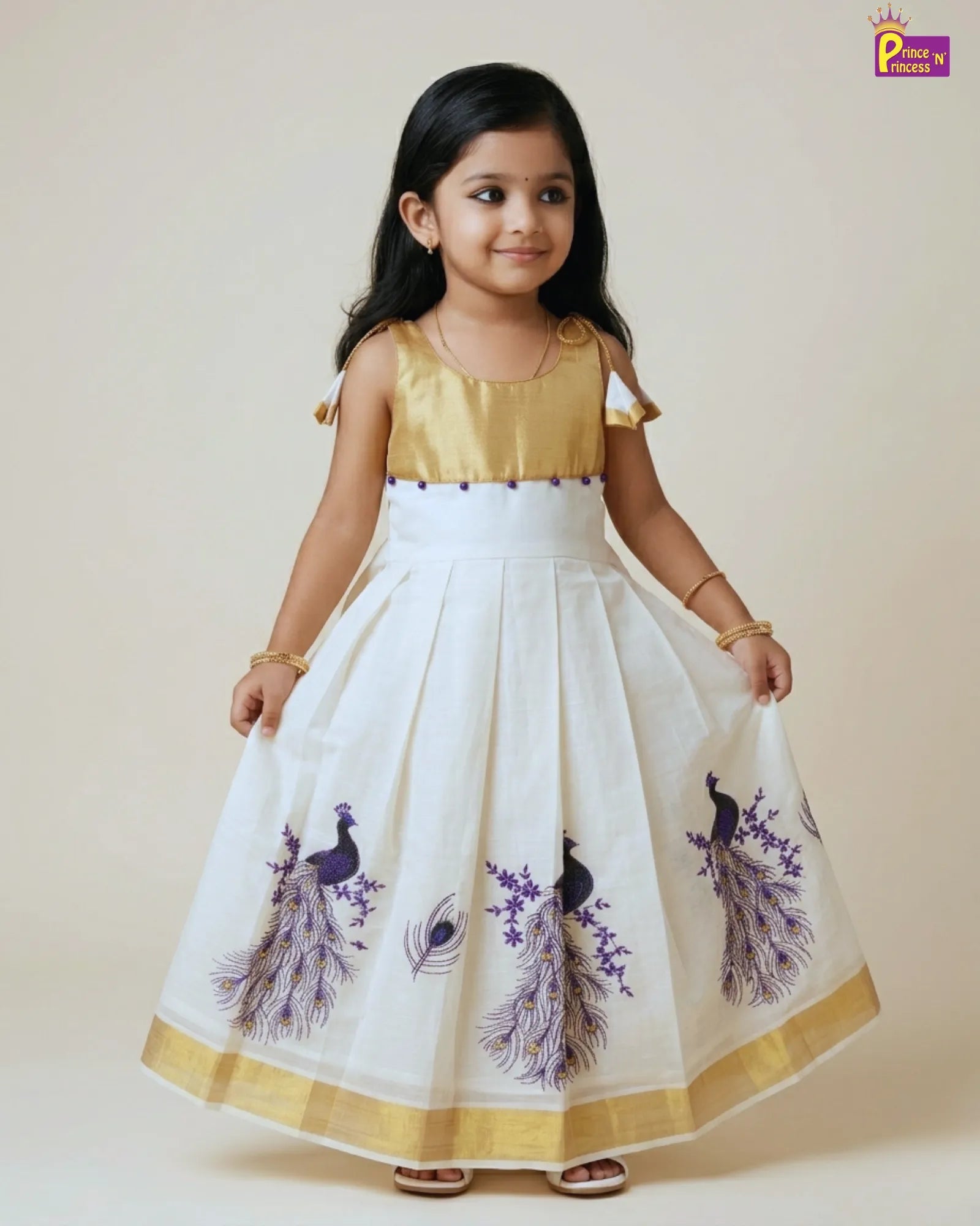 Young girl wearing a white dress with purple peacock designs on a beige background