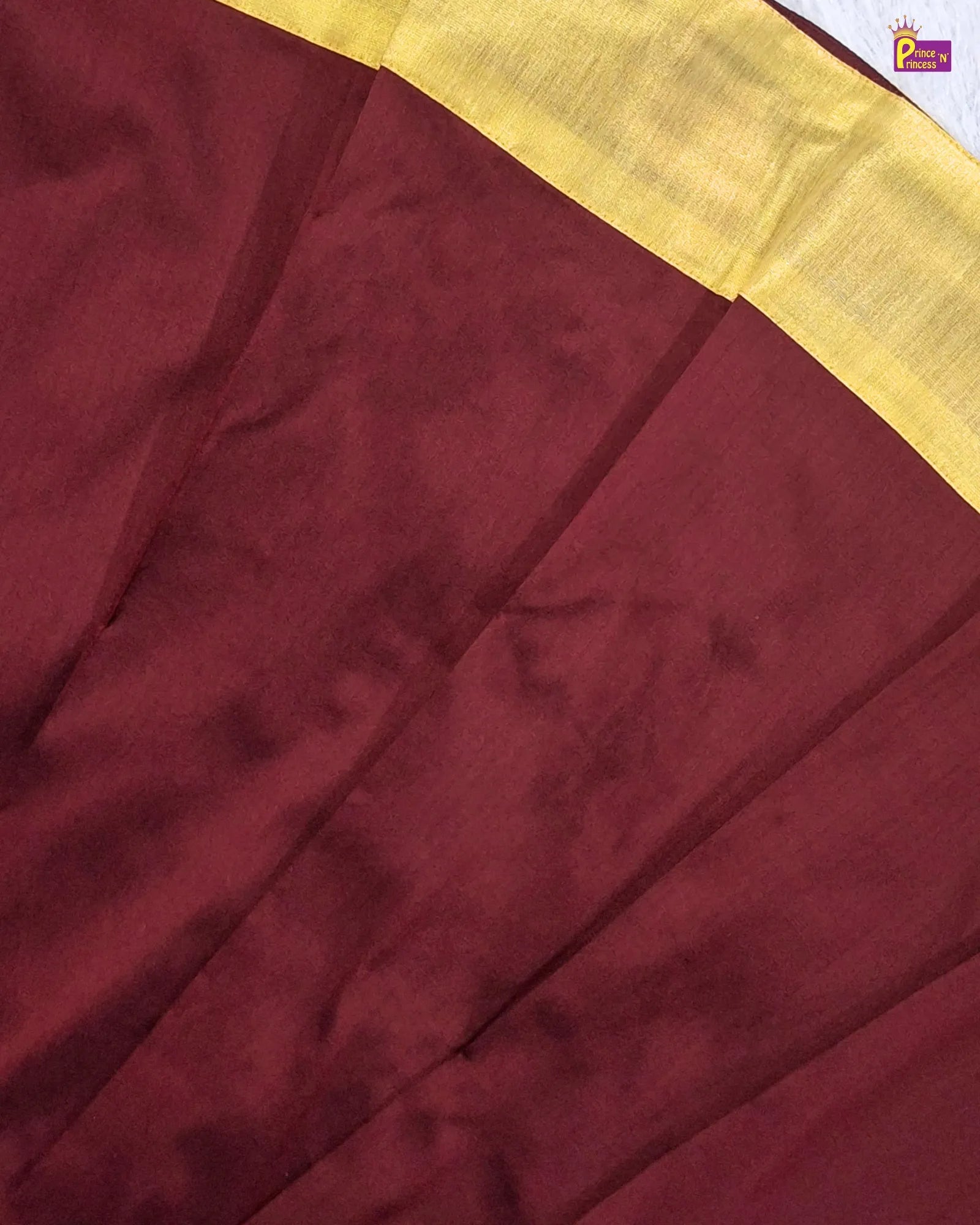 Maroon fabric with a yellow border
