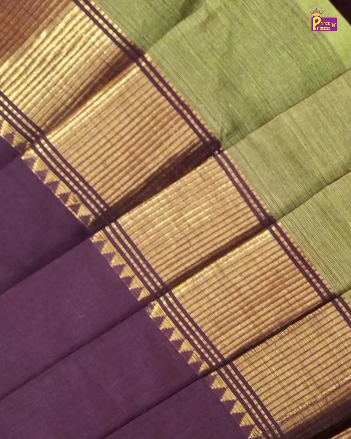 A close-up of a traditional Indian silk saree fabric, showing a light olive green body, a wide gold zari border with geometric patterns, and a solid deep purple pallu end.