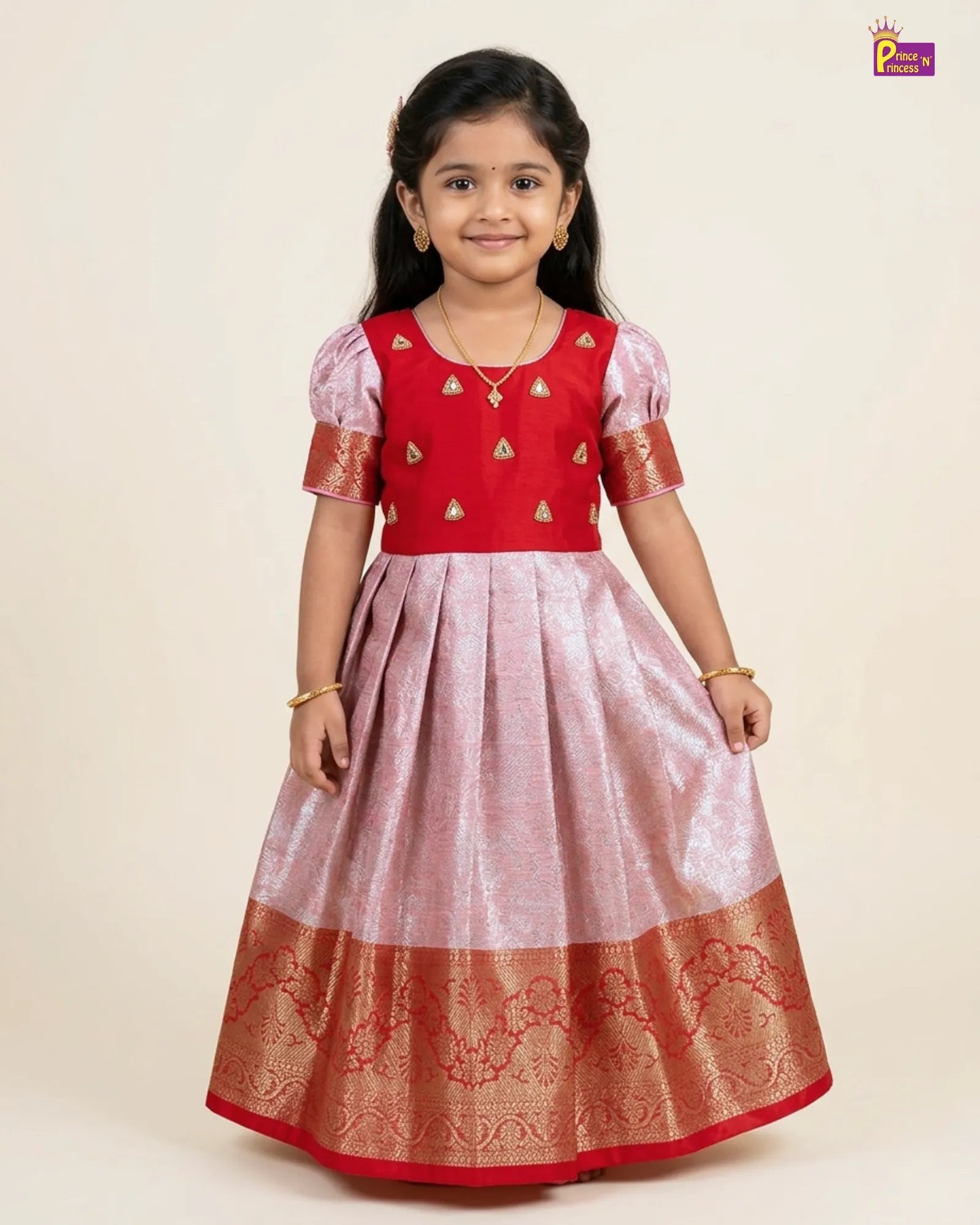 Young girl wearing a red and white traditional outfit with gold details on a beige background