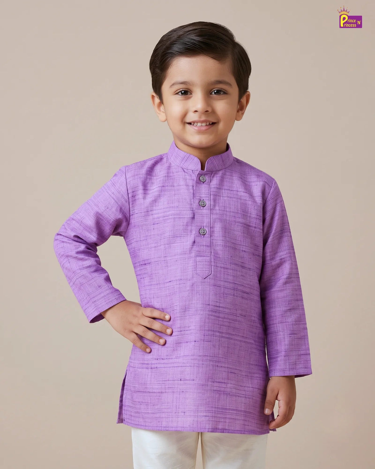 A young boy modeling a lavender purple long-sleeve kurta with a mandarin collar and three front buttons, paired with off-white trousers, against a solid beige background.