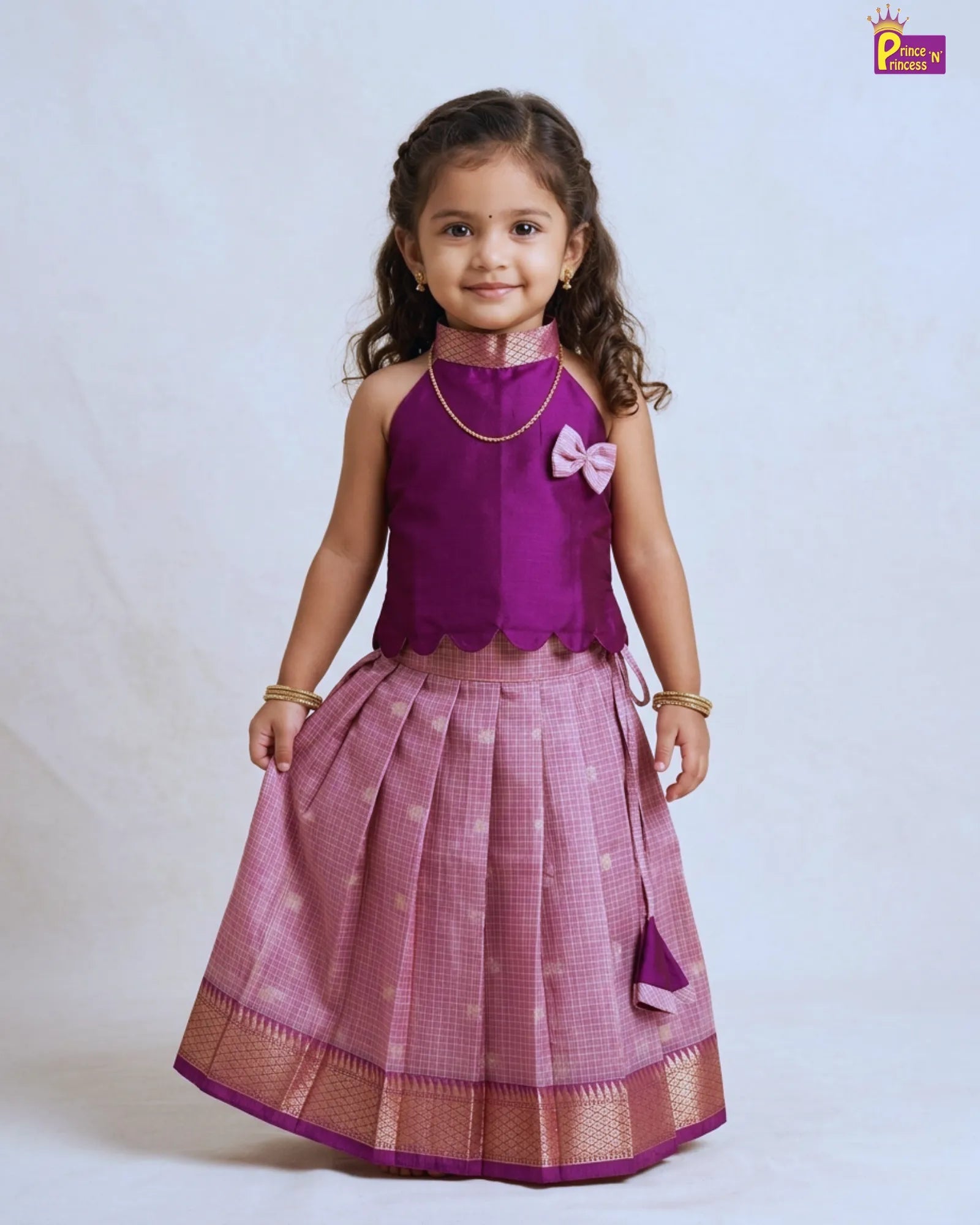 Girl wearing modern violet raw silk pattu pavadai traditional kids dress