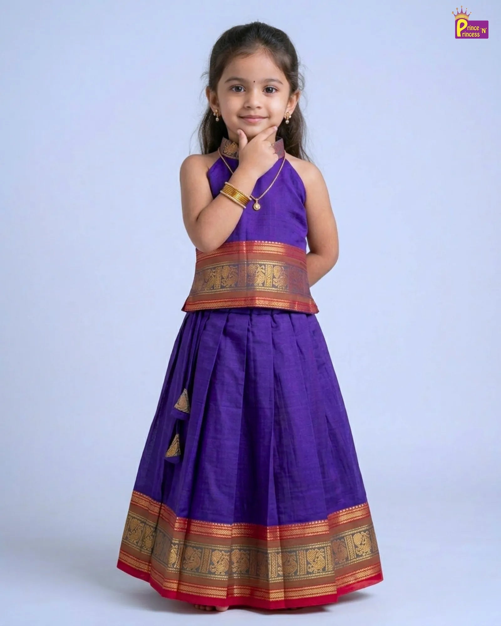 Girl wearing navy blue Chettinad cotton pattu pavadai traditional kids ethnic dress