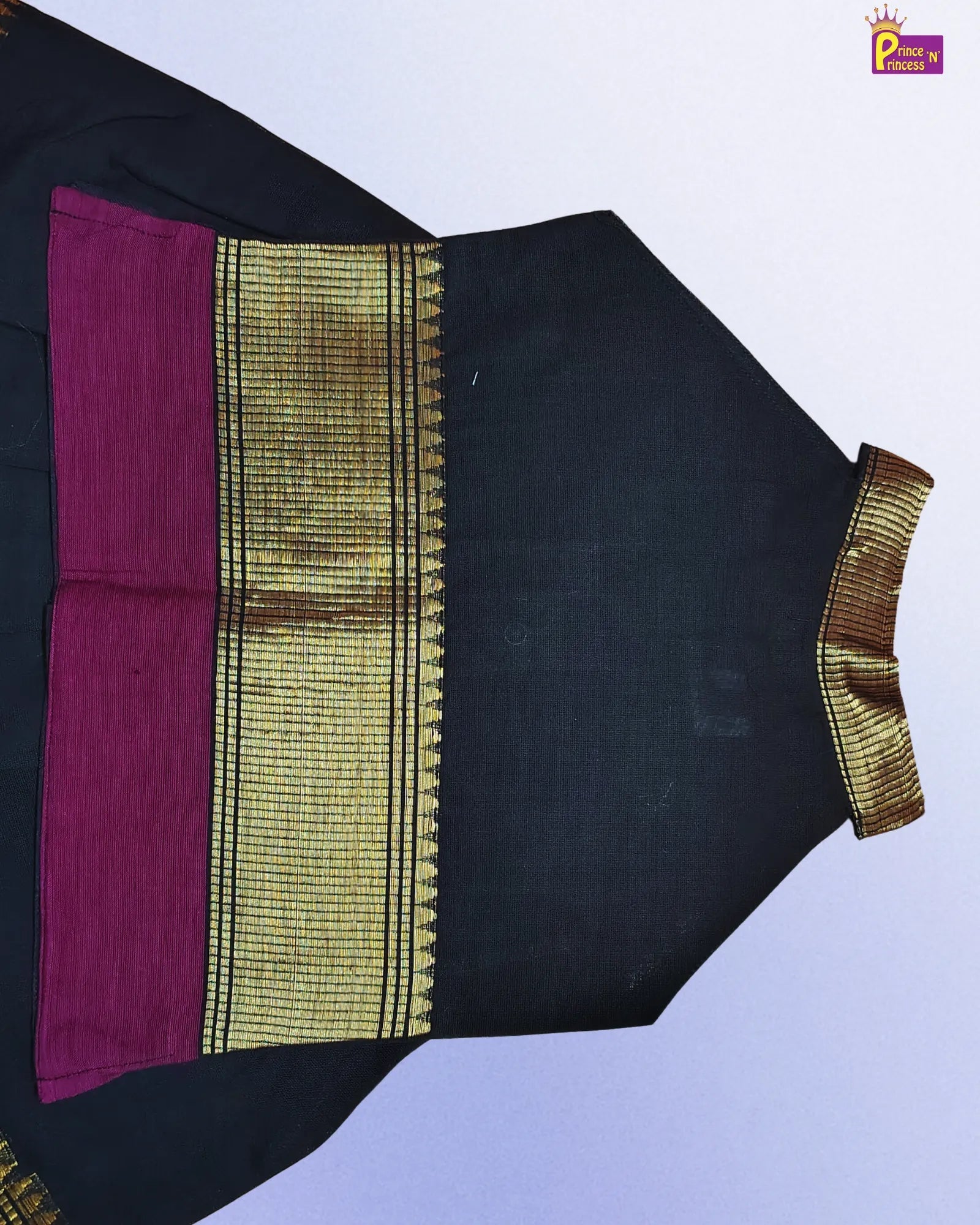 Black blouse with gold and pink details on a white background
