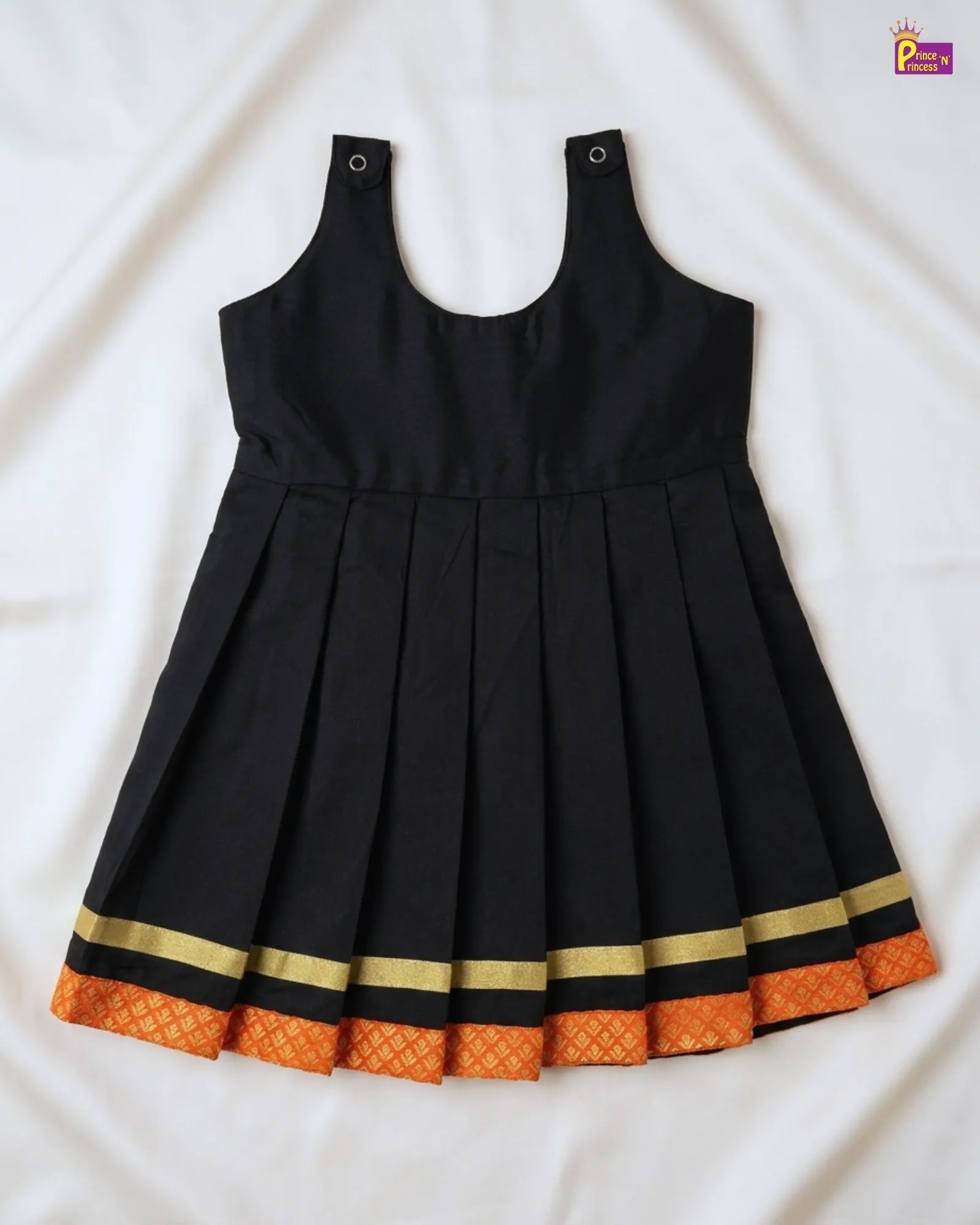 Black dress with orange and gold trim on a white background