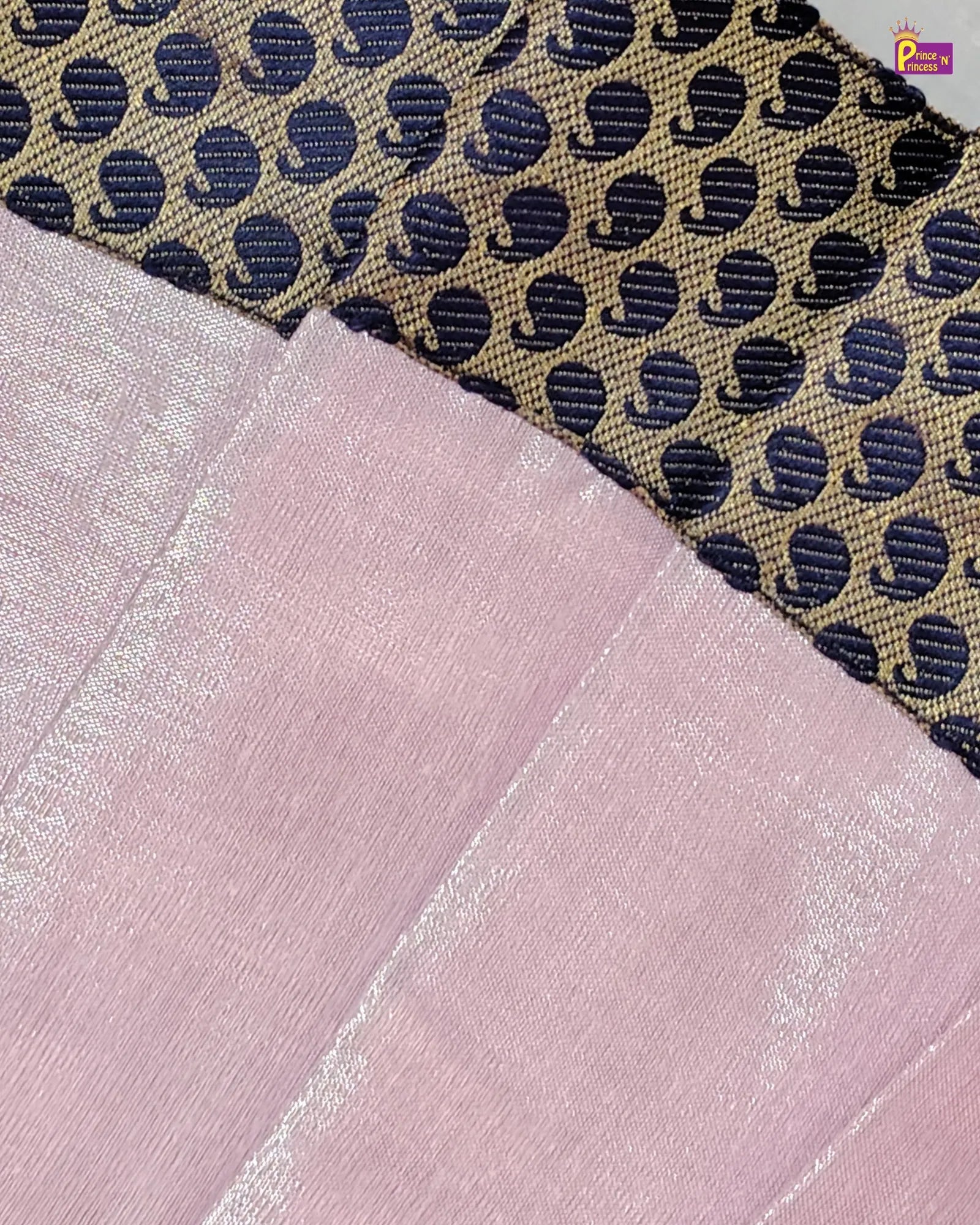 Fabric swatches including a patterned fabric and a plain pink fabric.