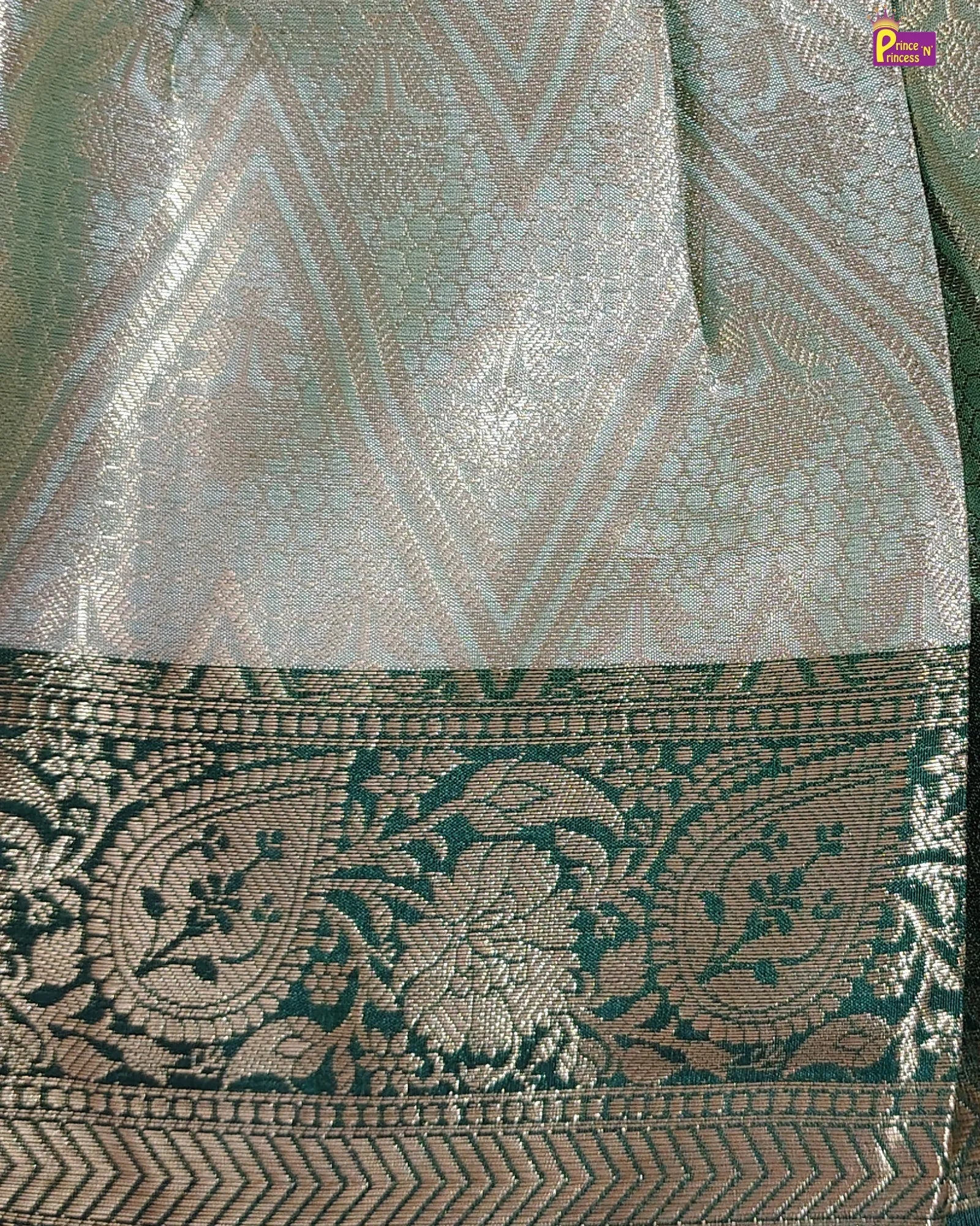 Close-up of a patterned fabric with geometric and floral designs.