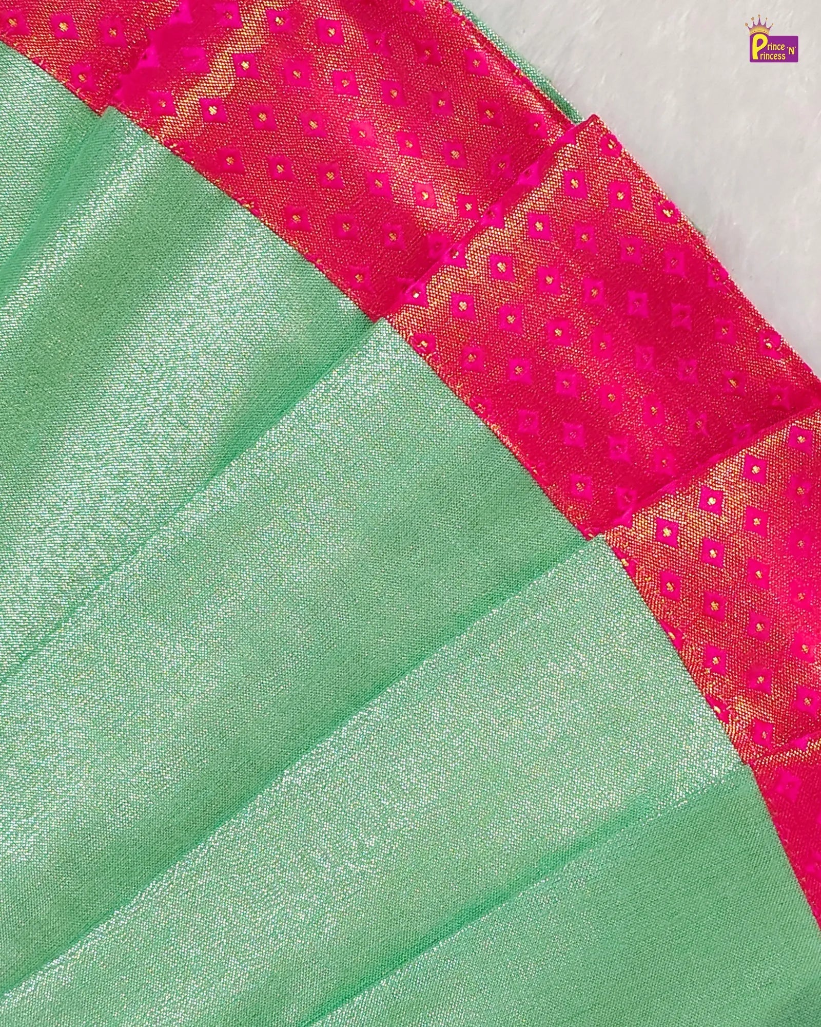 Green fabric with pink and gold border