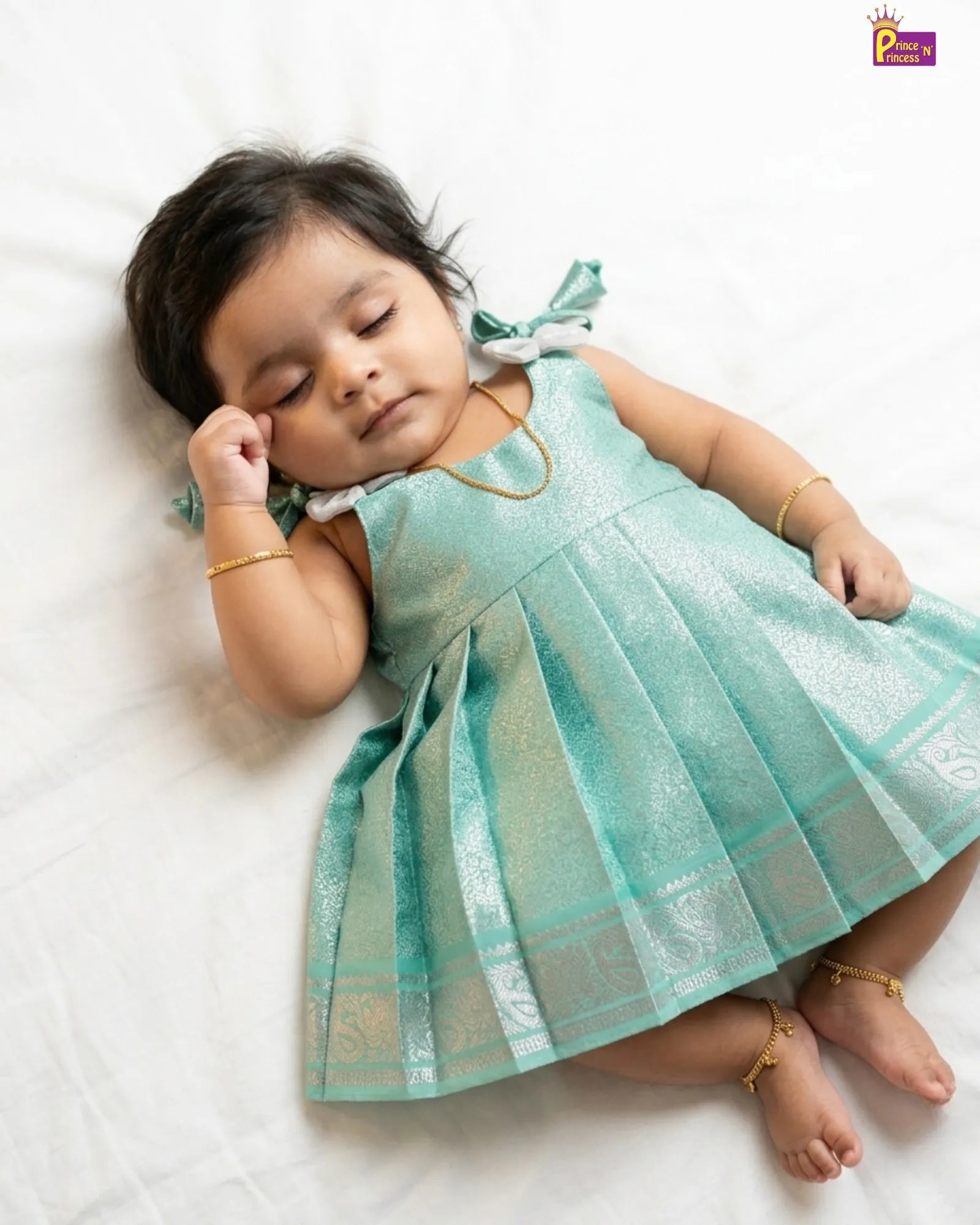 Wide silver peacock Kanjivaram border on mint teal silver gold zari brocade newborn pattu frock from Prince N Princess collection