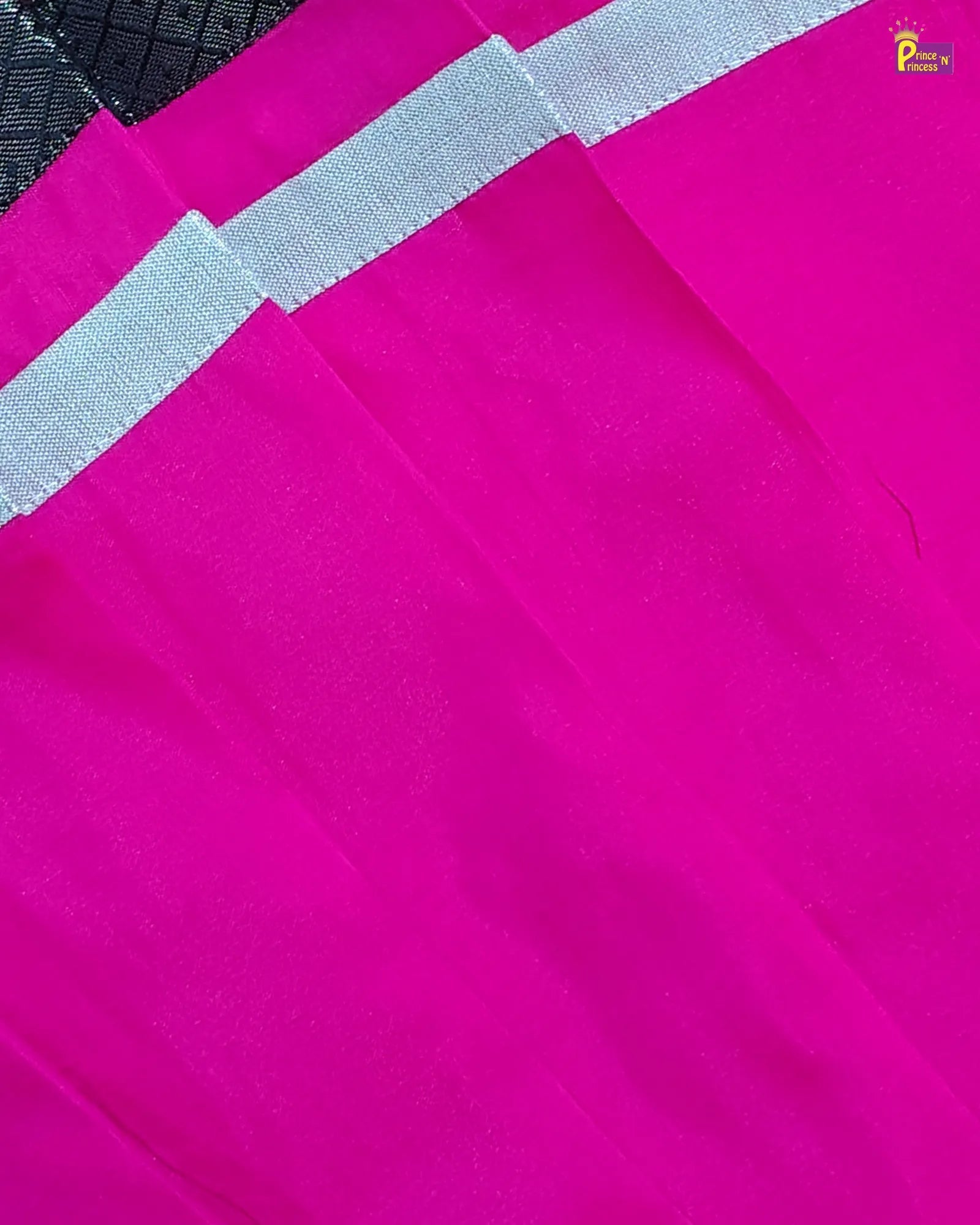 Close-up of a pink fabric with a gray stripe, brand 'Peachy' visible.