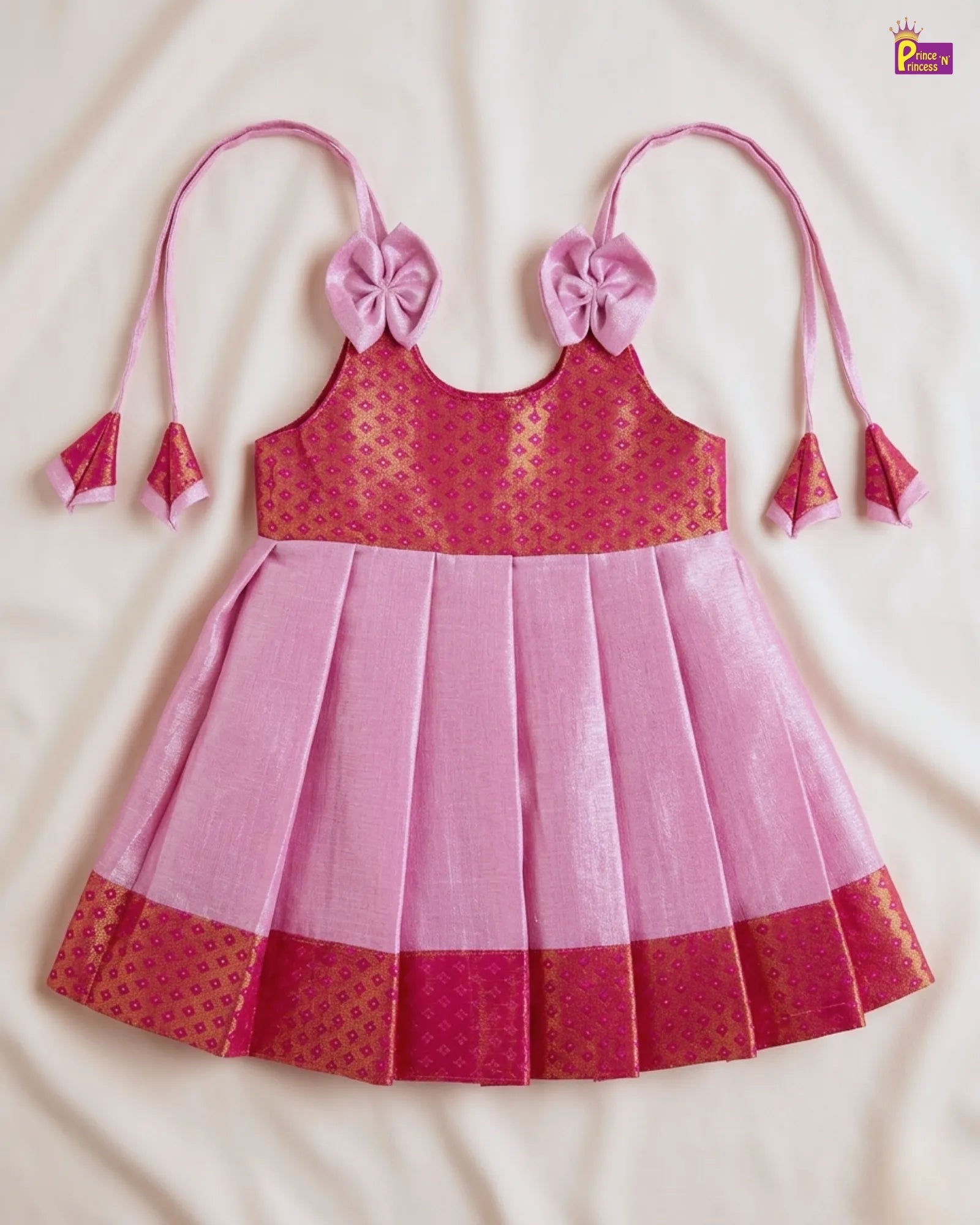 Pink and red dress with floral straps on a beige background