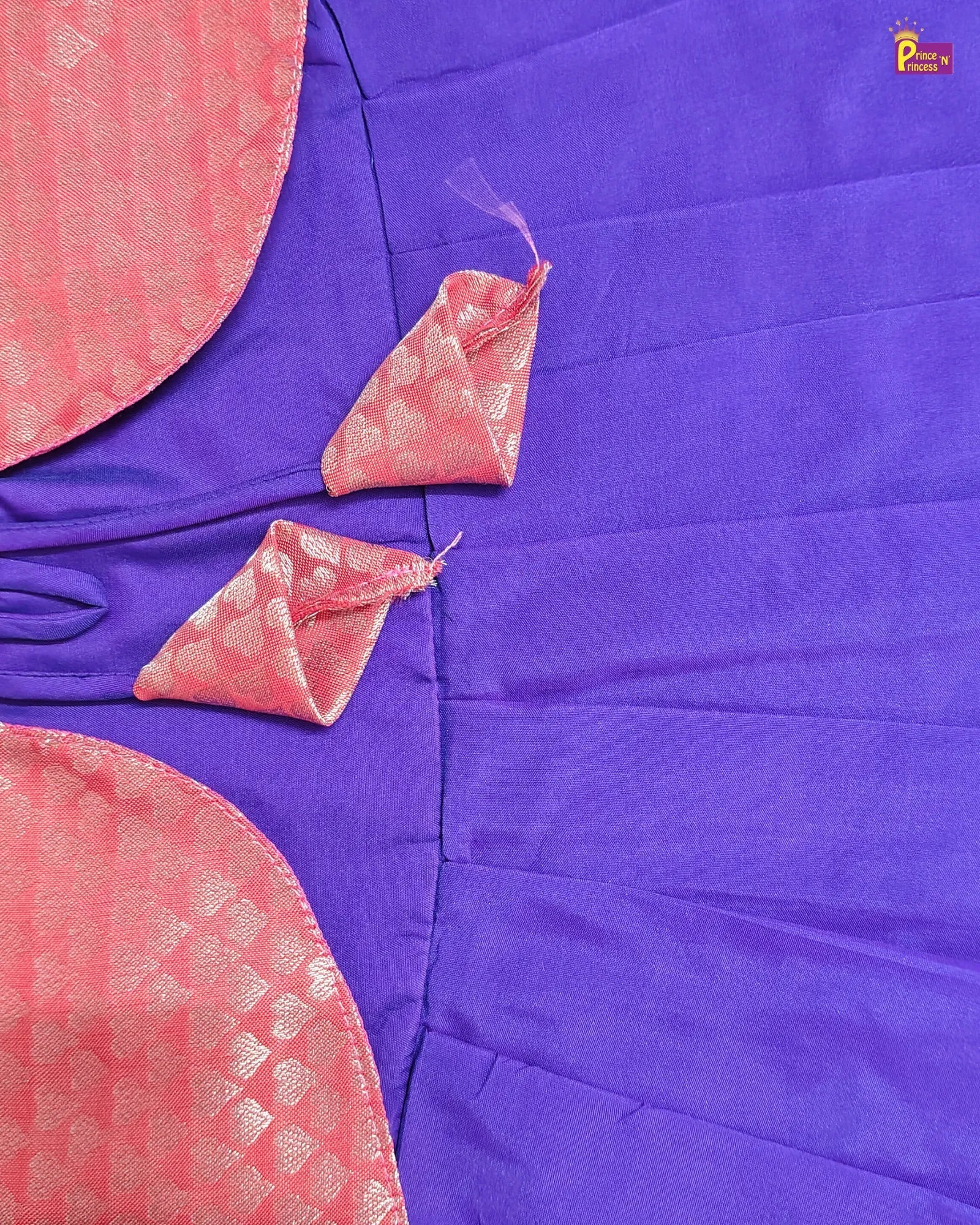 Purple fabric with pink decorative elements