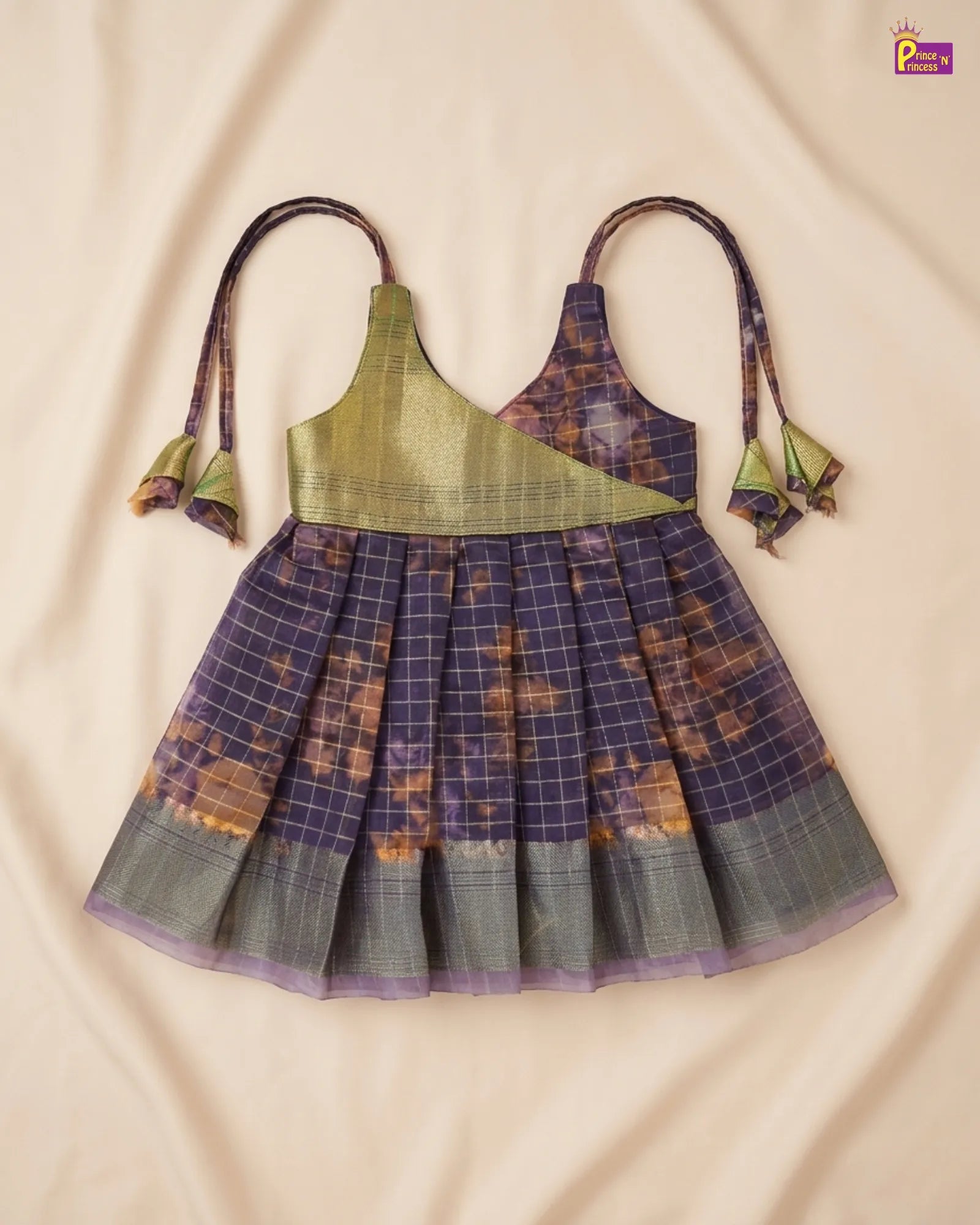 Traditional dress with plaid pattern on a beige fabric background