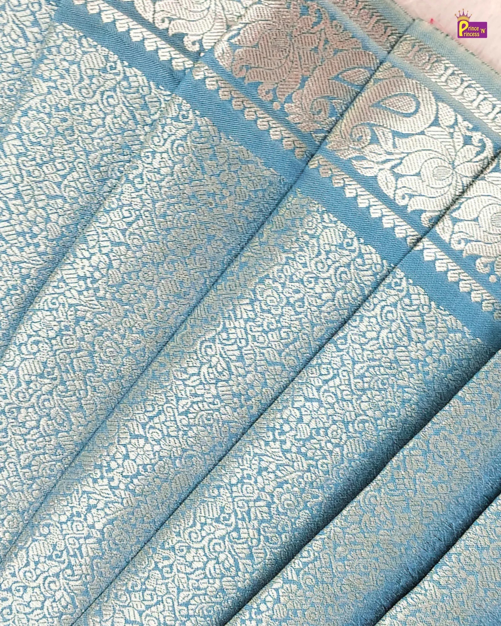 Blue and white patterned fabric with intricate designs