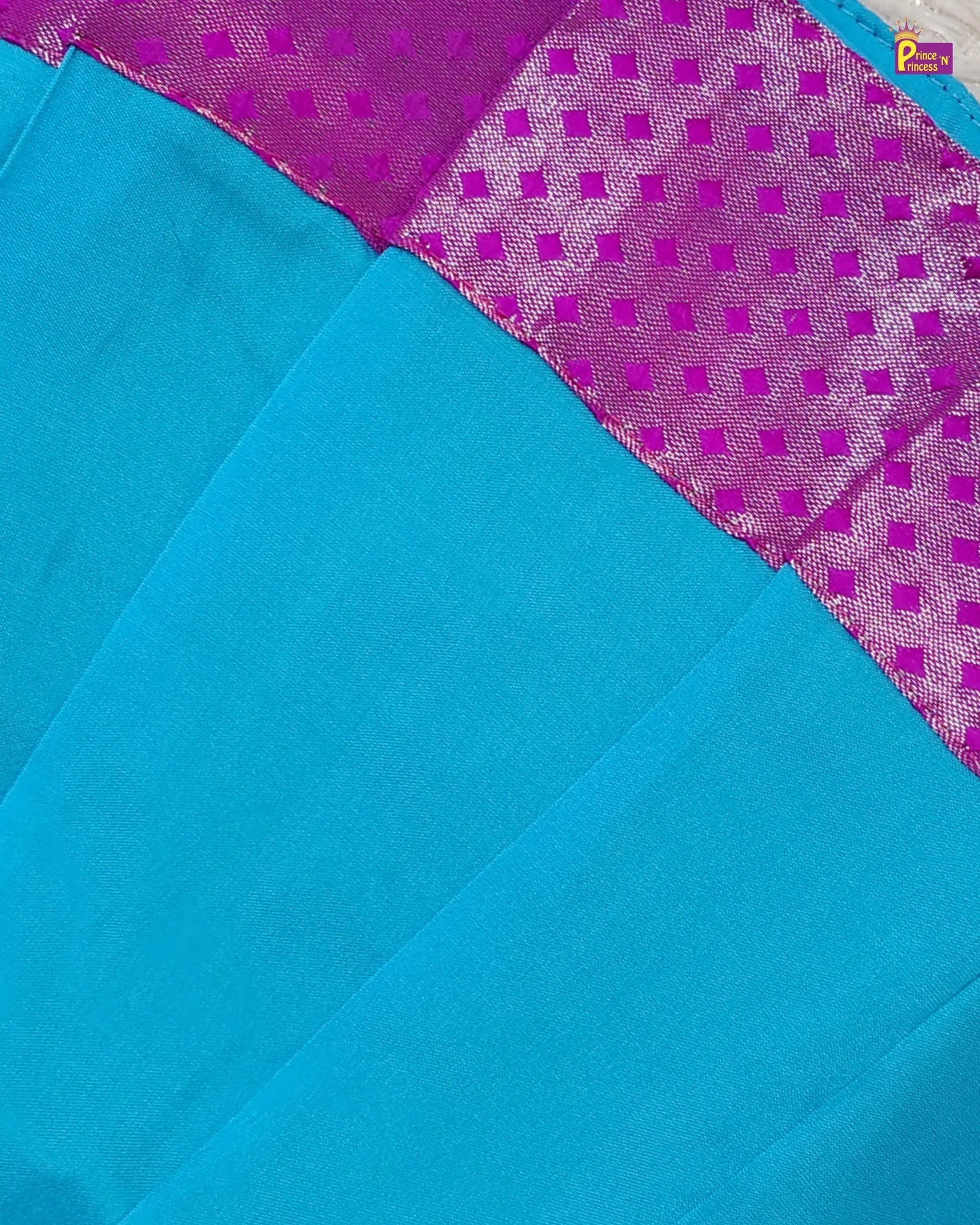 Blue fabric with purple geometric pattern