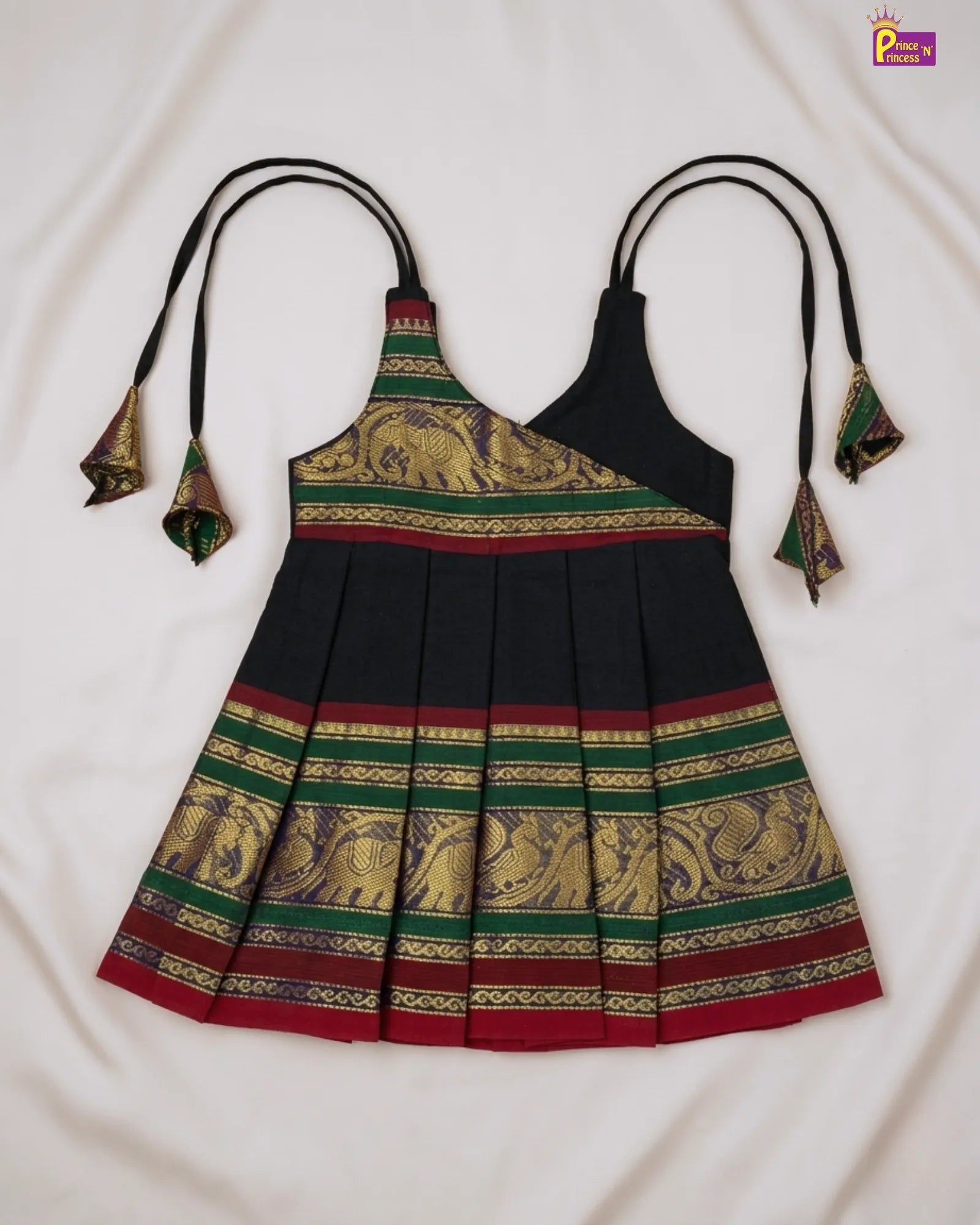 Traditional dress with elephant patterns on a white background