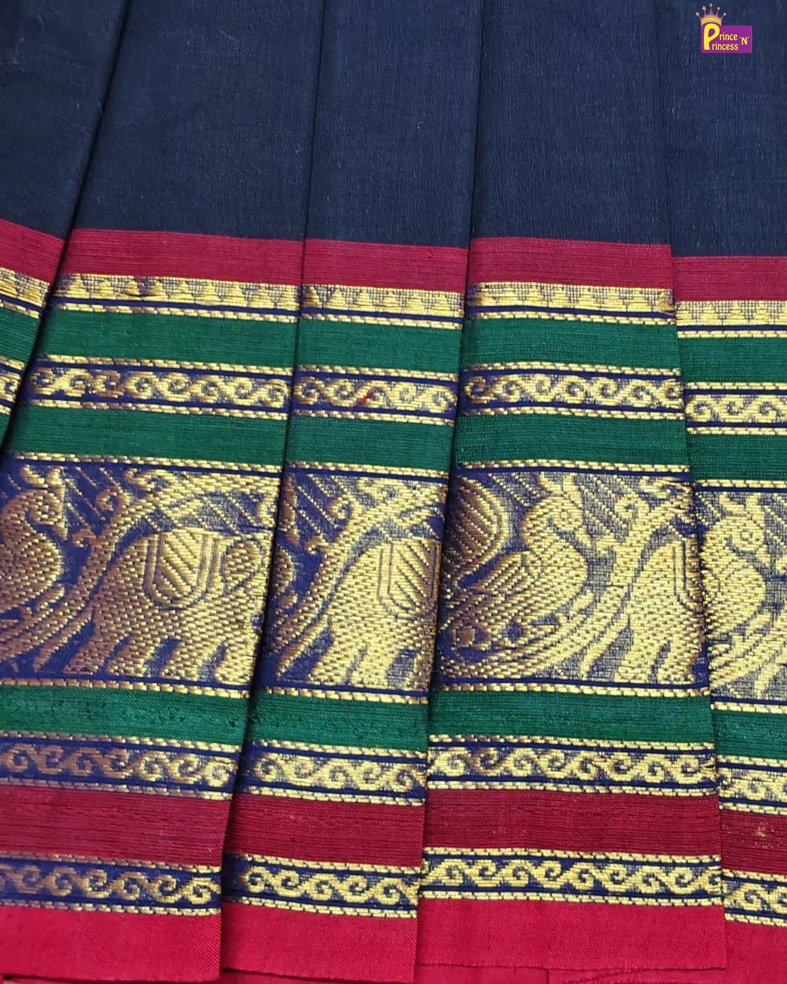 Traditional fabric with intricate patterns and colors, featuring blue, green, and red hues.