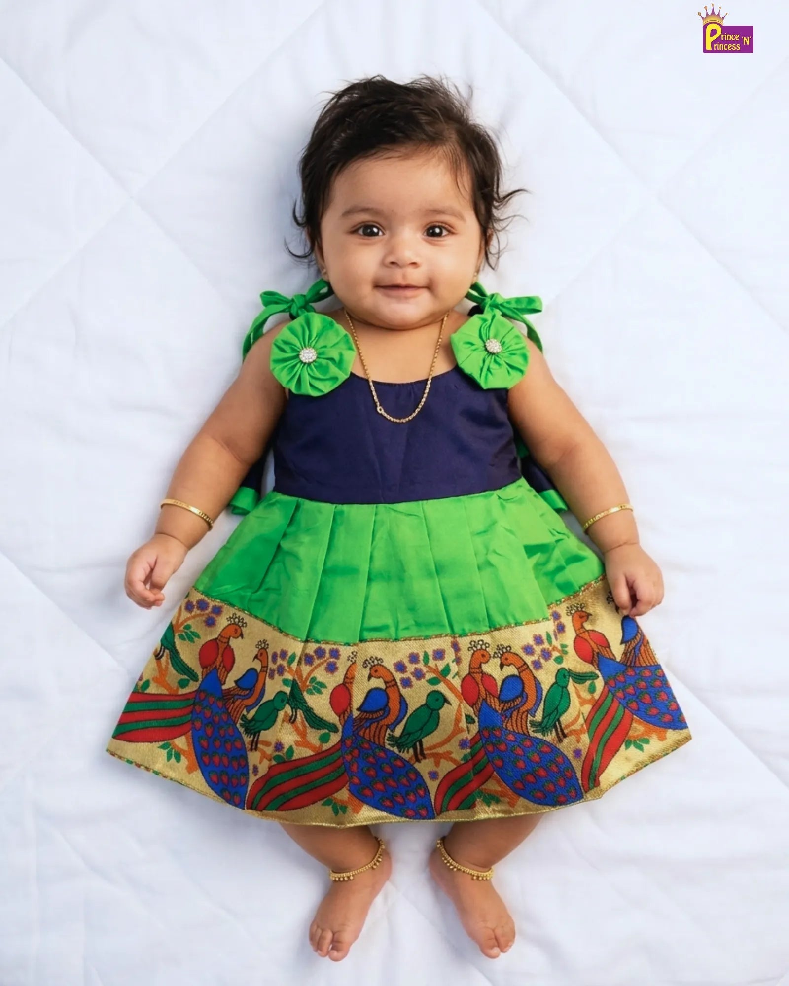 newborn green pattu frock with colorfull peacock border