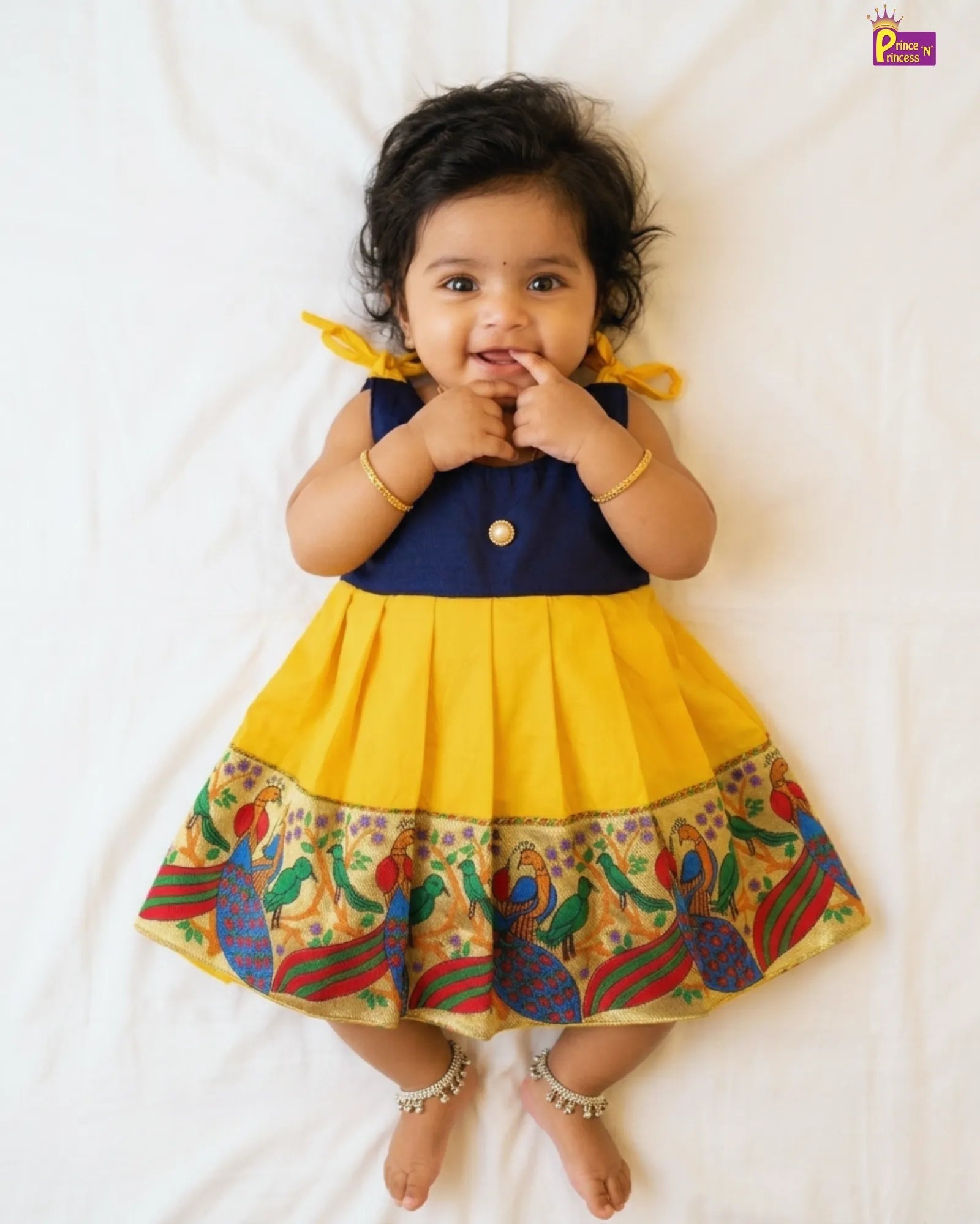 newborn yellow pattu frock with peacock design border at princenprincess