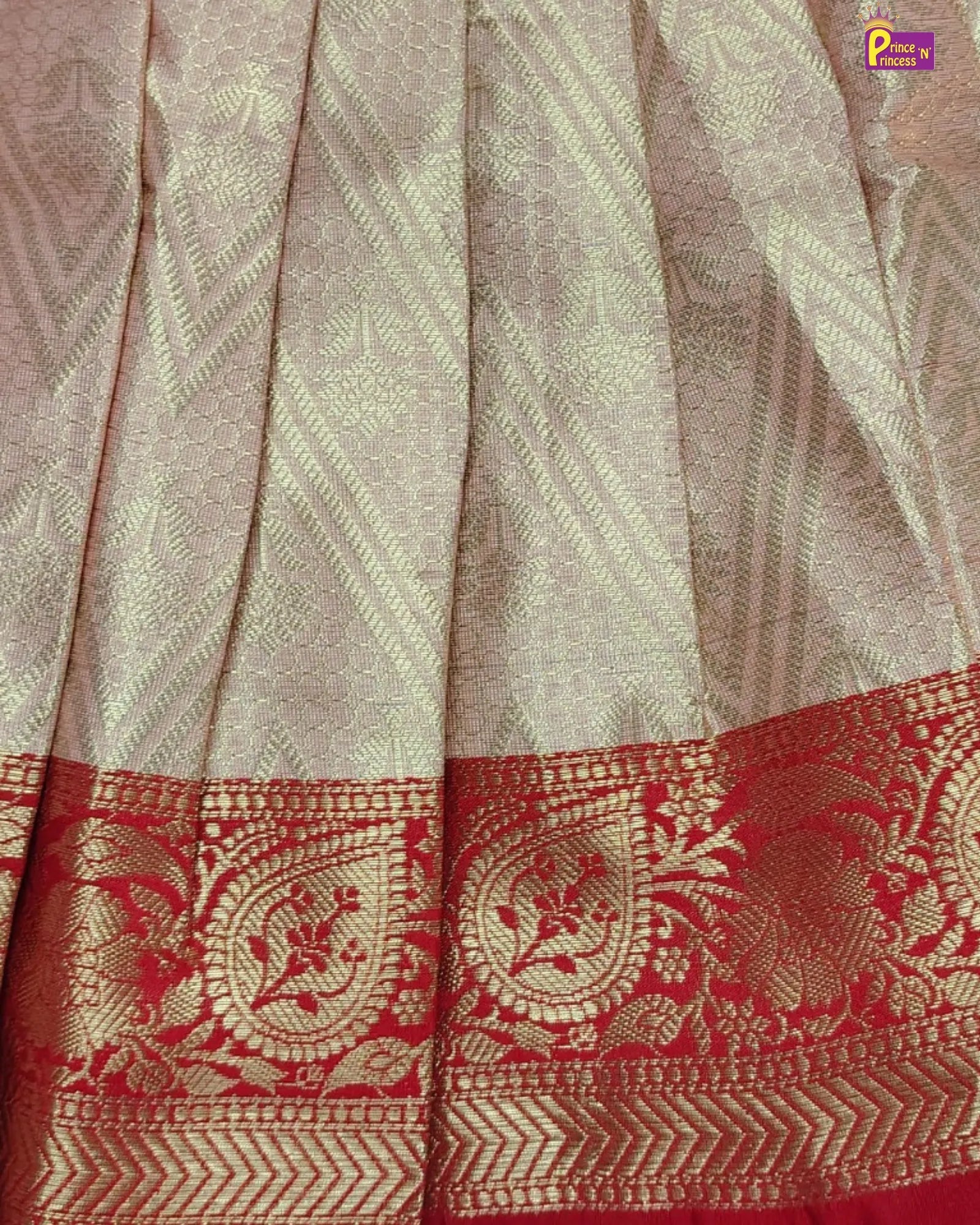 Beige and red embroidered dress with floral details on a beige background