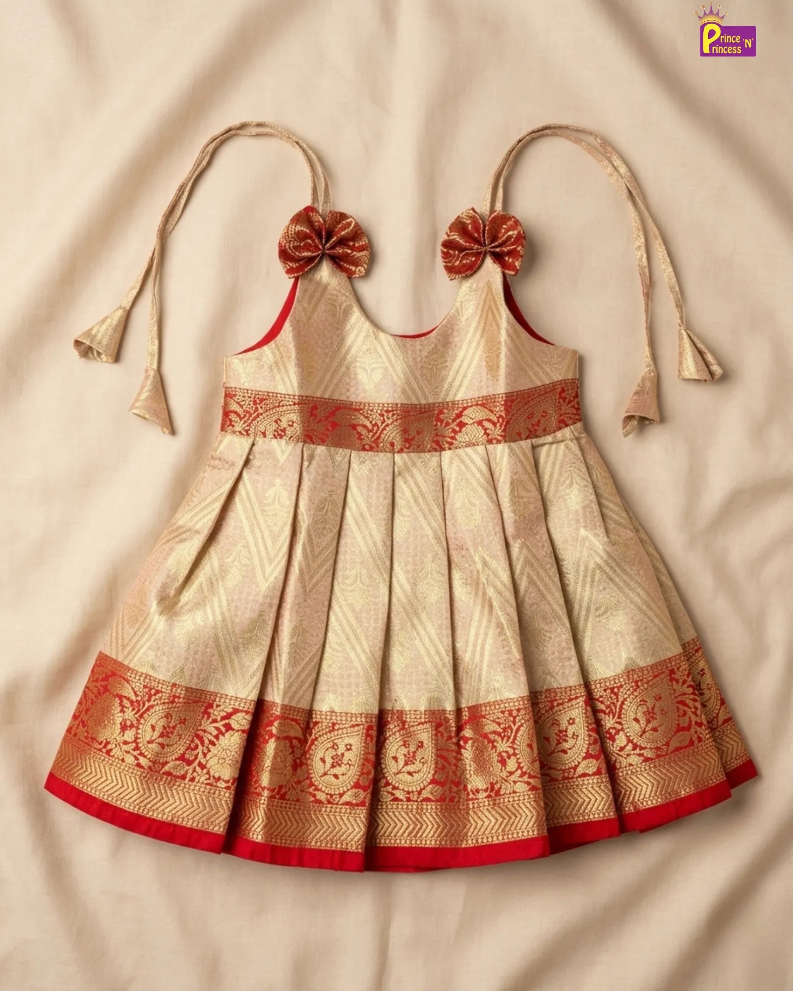 Beige and red embroidered dress with floral details on a beige background