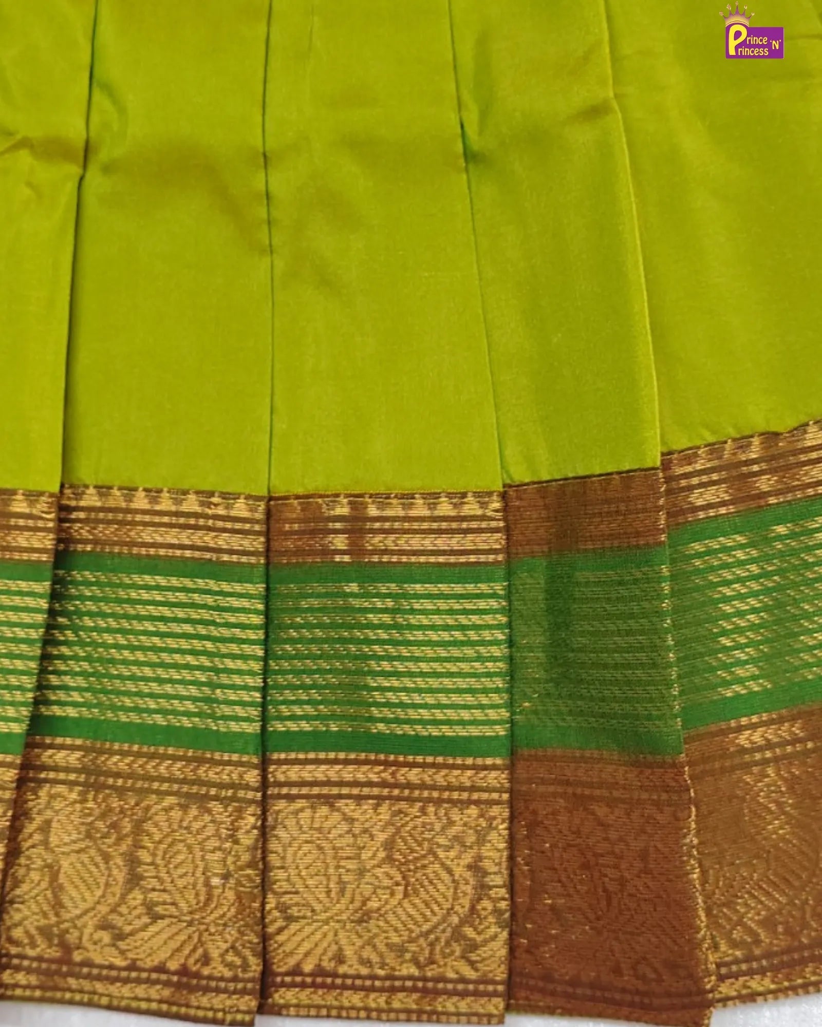 Green and brown traditional fabric with intricate patterns