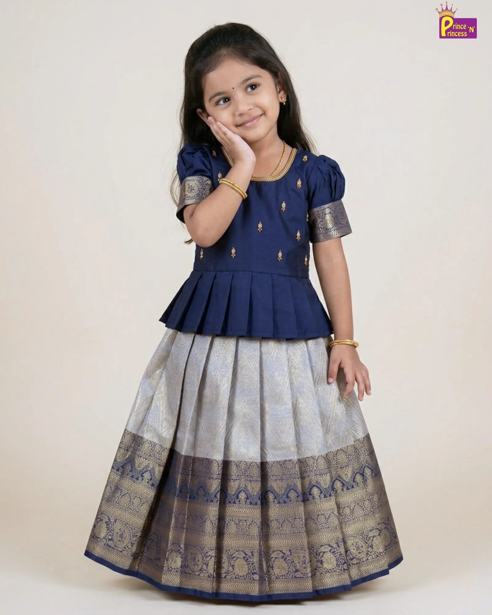 cute adorable pose of cute girl wearing our premium pattu pavadai 
