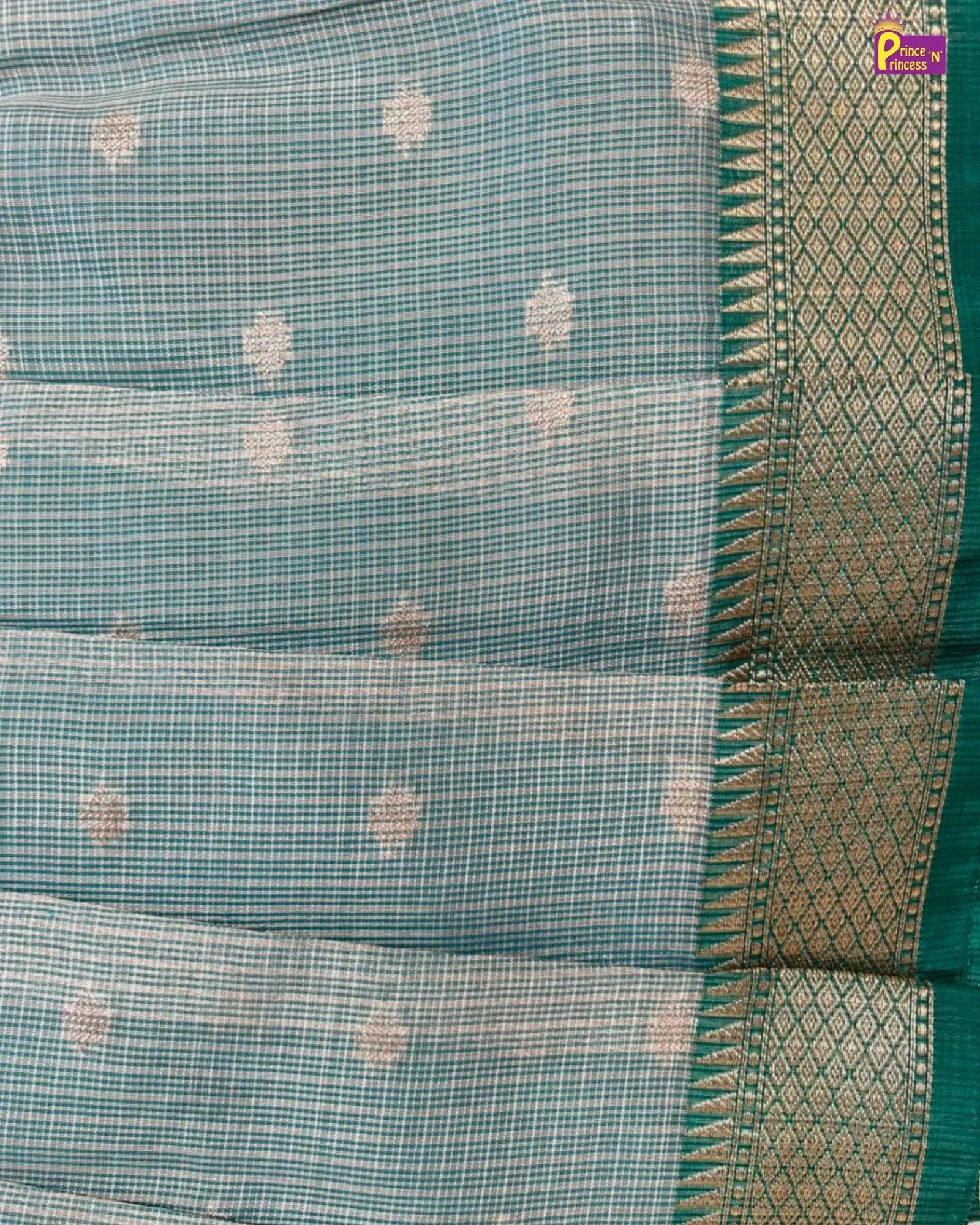 Teal saree with a patterned border
