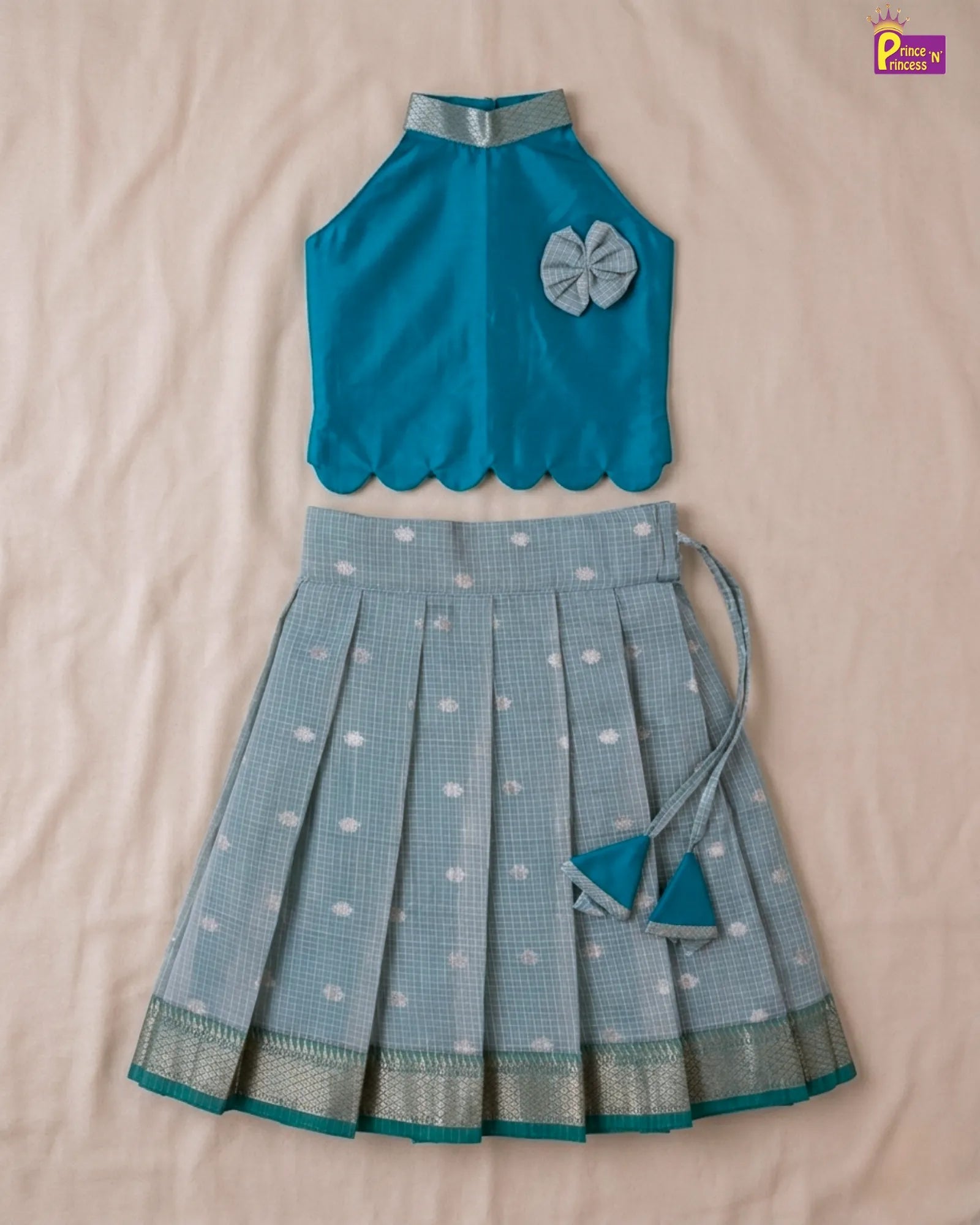 Blue top and skirt set on a beige background