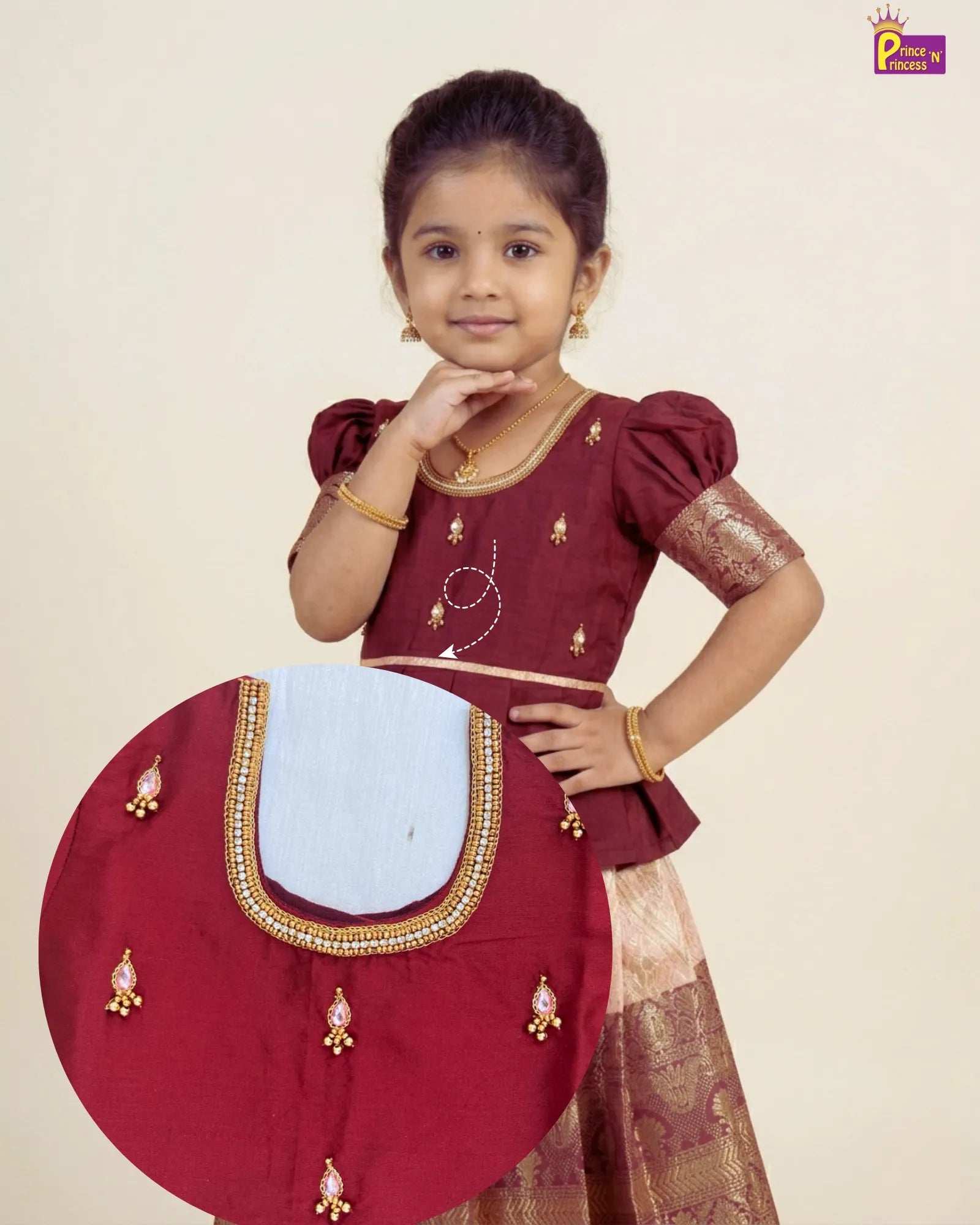 the girl wearing Pattu Pavadai with Aari Work Puff Sleeve