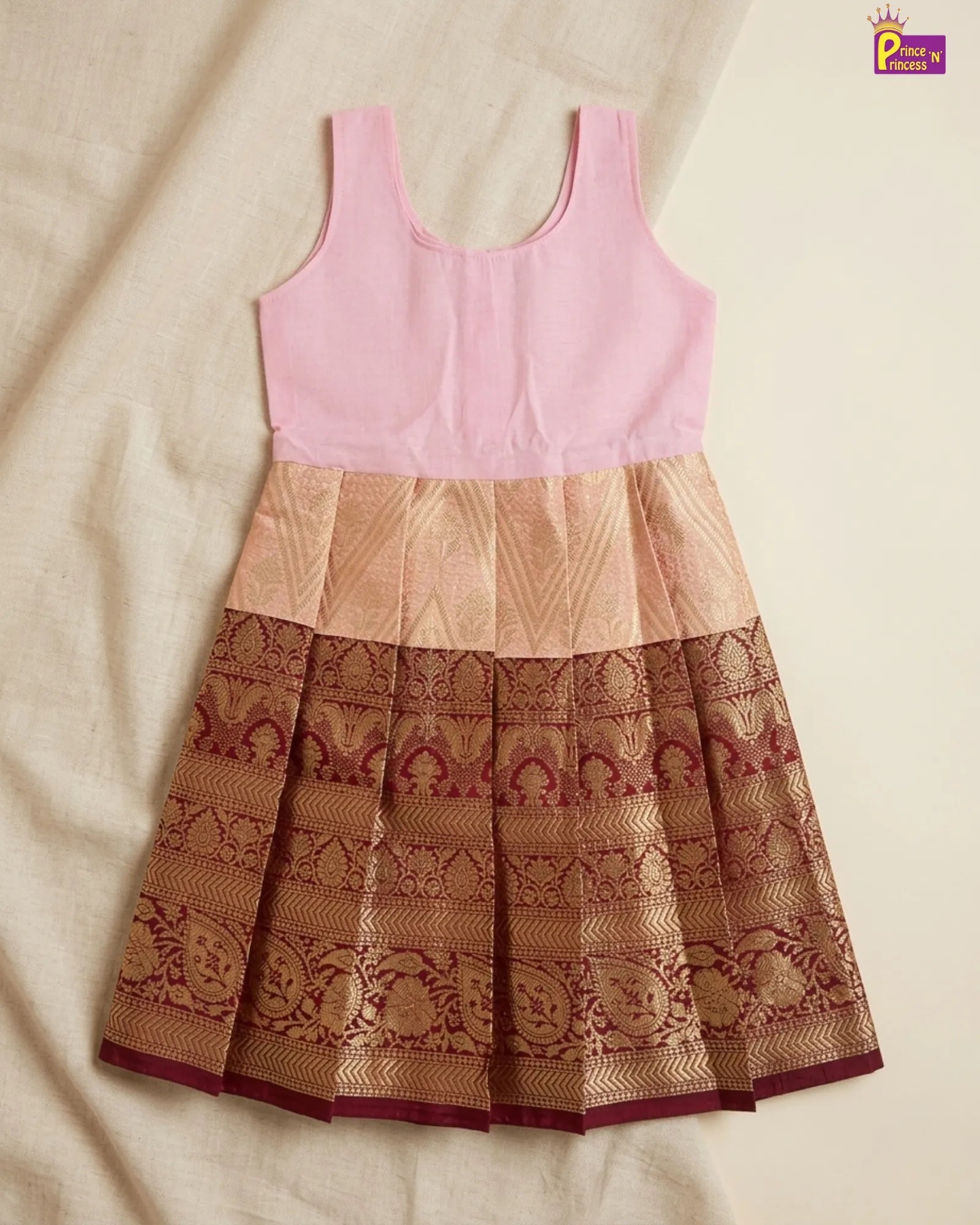 the girl wearing Pattu Pavadai with Aari Work Puff Sleeve