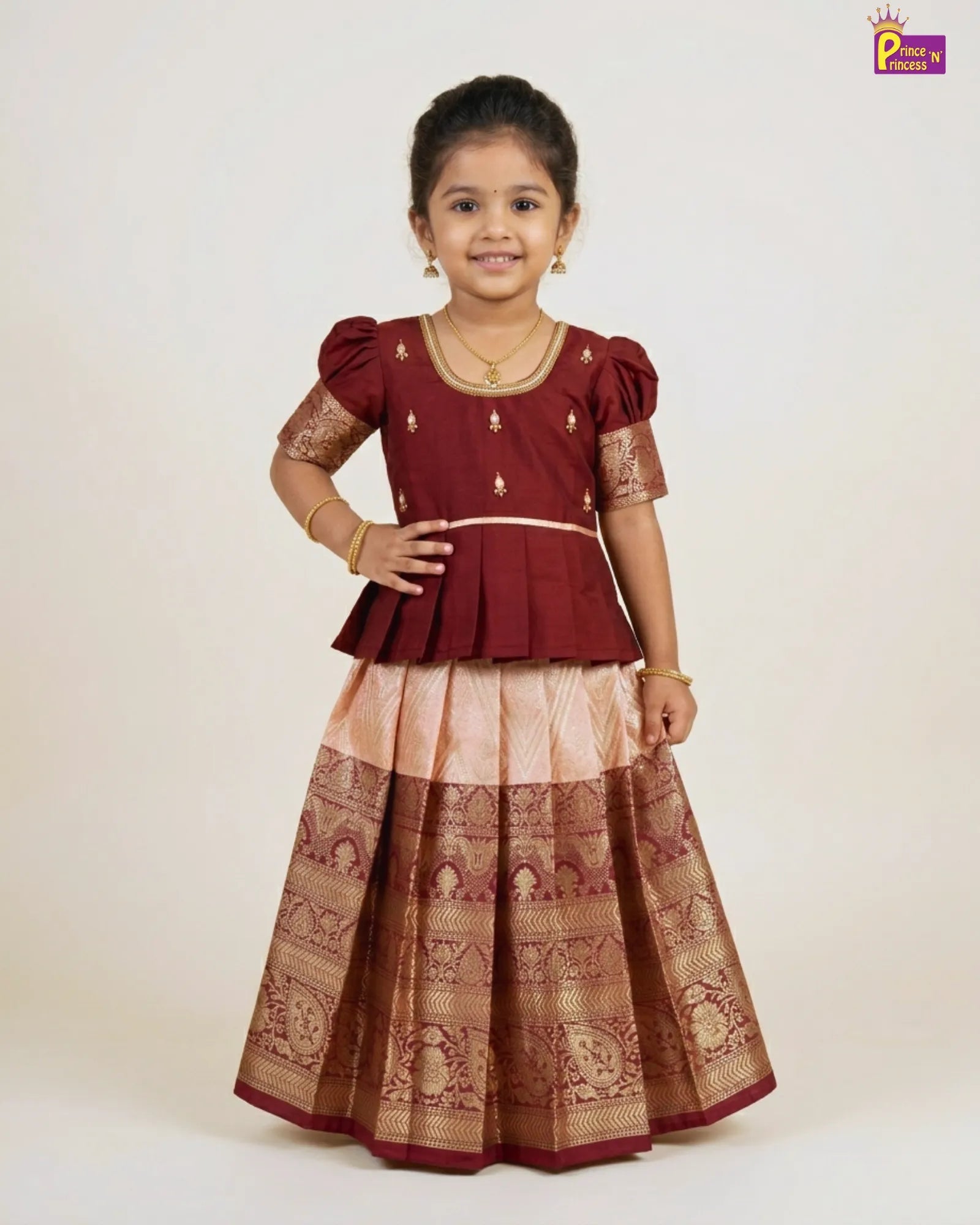 the girl wearing Pattu Pavadai with Aari Work Puff Sleeve