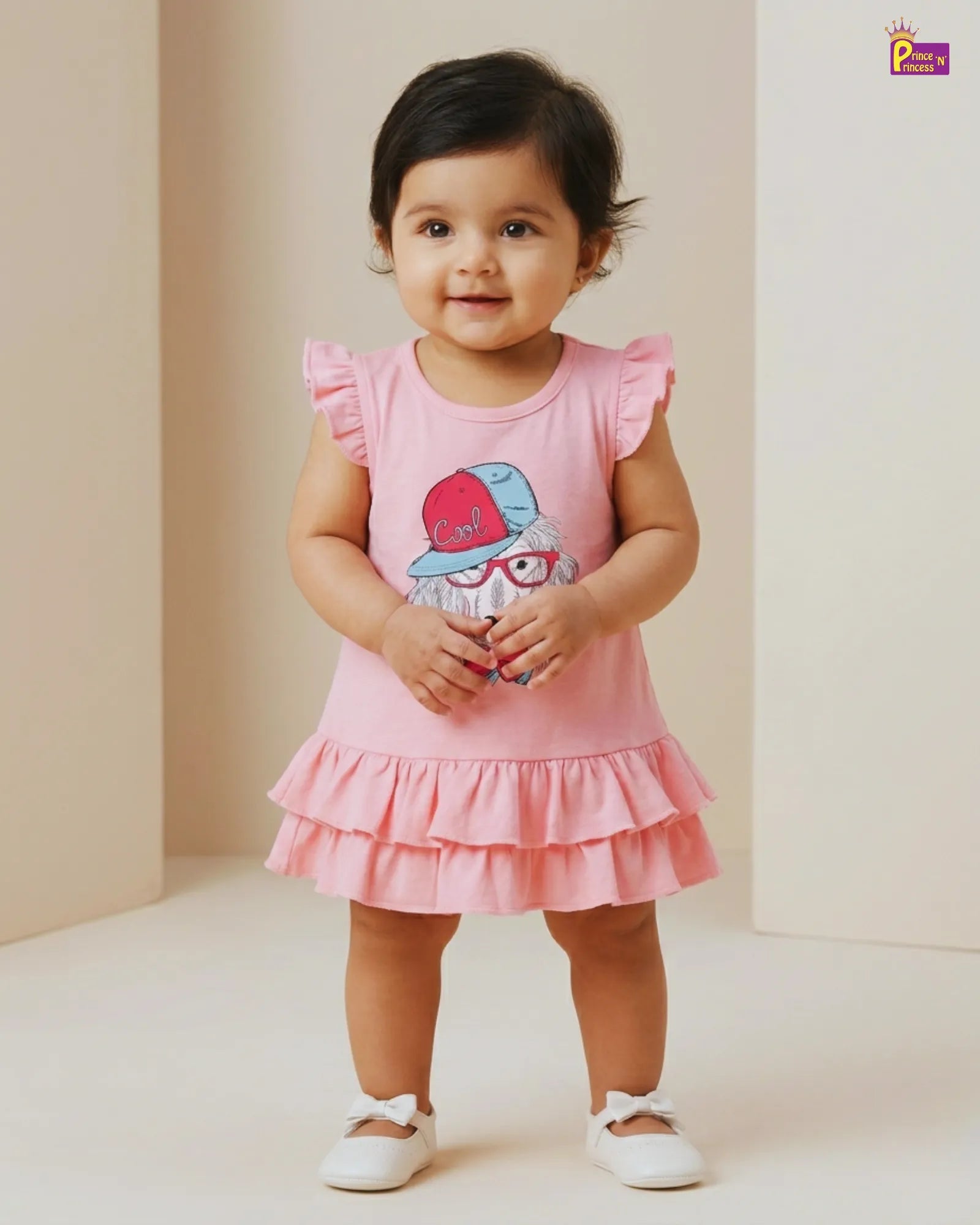 Child wearing a pink dress with a cartoon character on a plain background