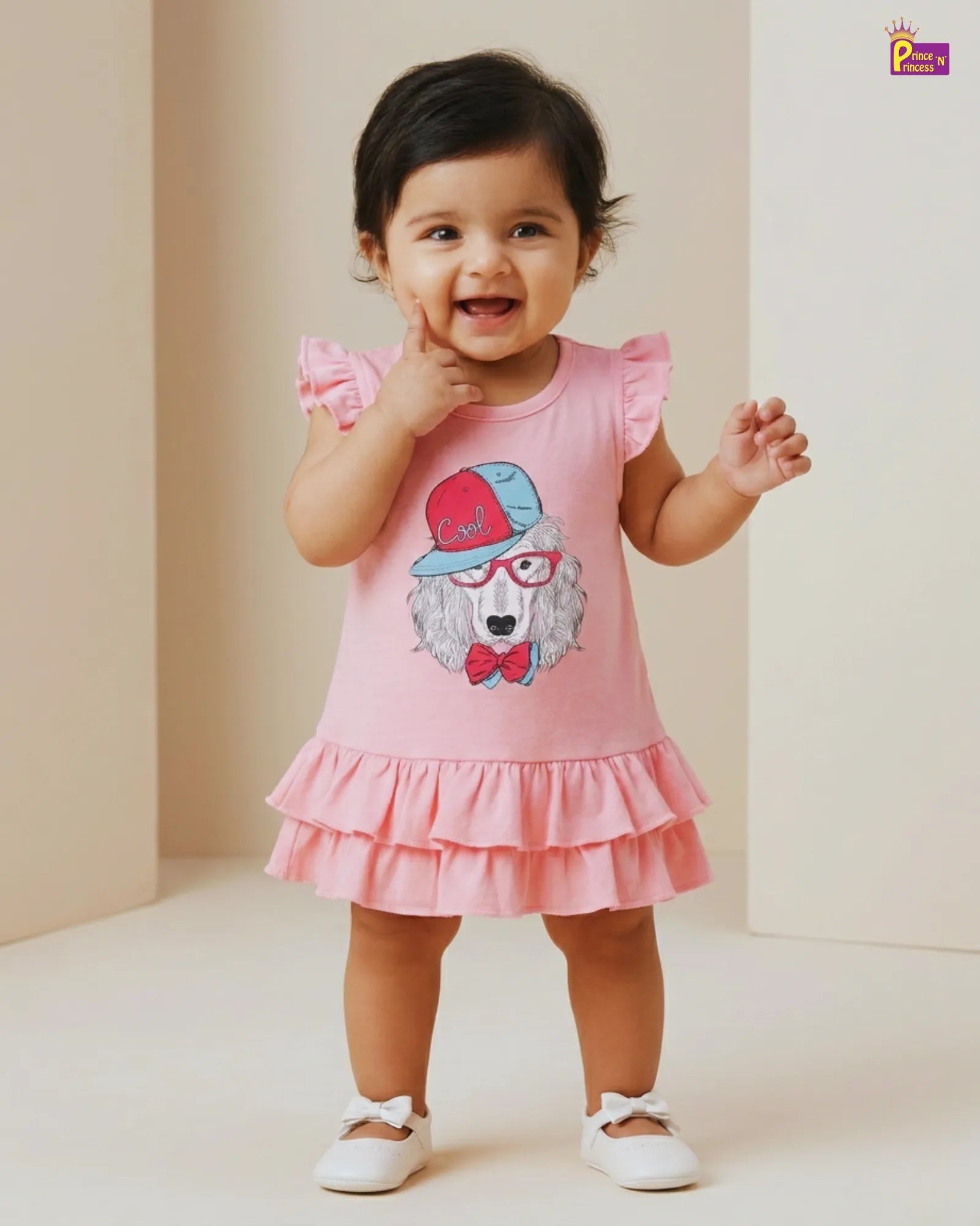 Child wearing a pink dress with a cartoon character on a plain background