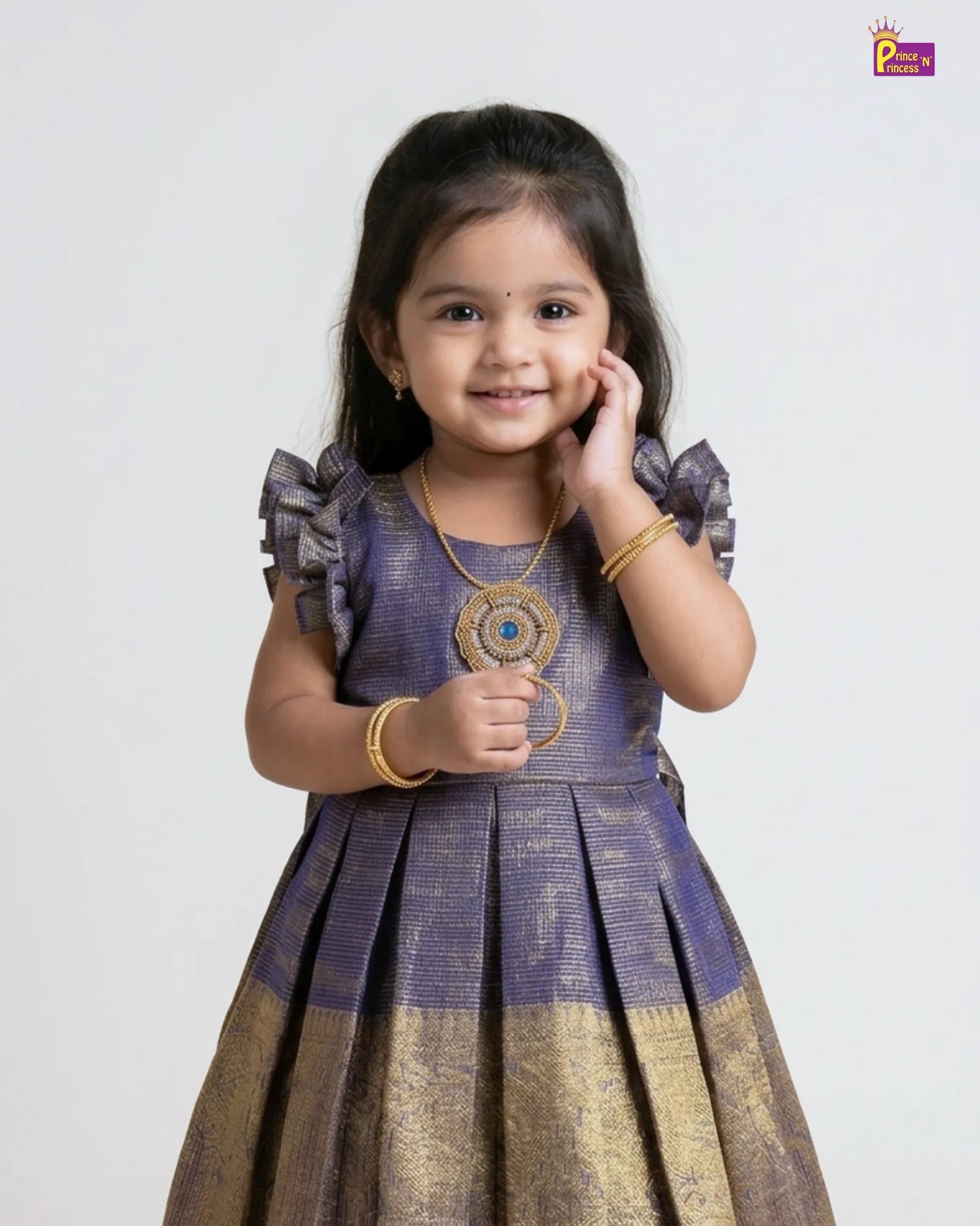 Young girl wearing a traditional outfit with a plain background