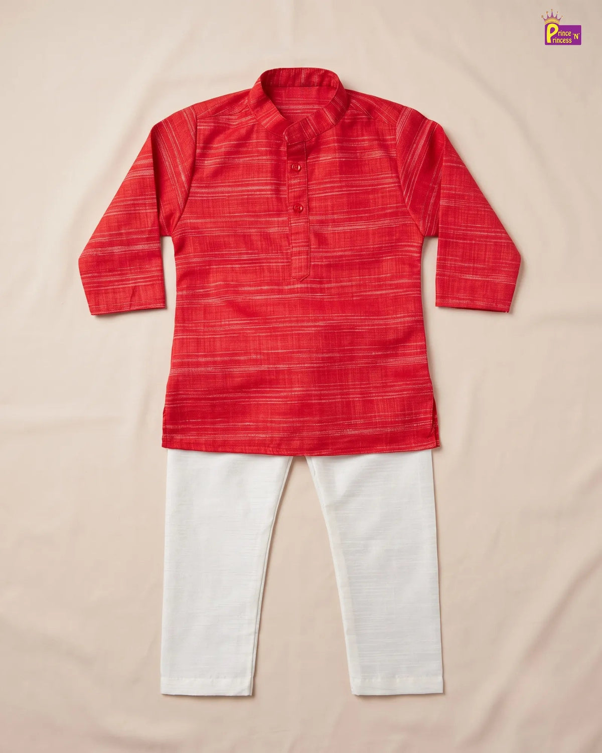 A two-piece children's outfit laid flat on a light beige fabric background, featuring a red long-sleeve kurta with subtle horizontal stripes and white pants.