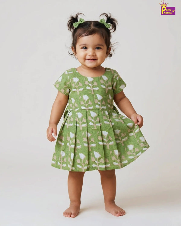 Baby girl wearing green floral summer cotton frock casual kids dress for daily wear and outings