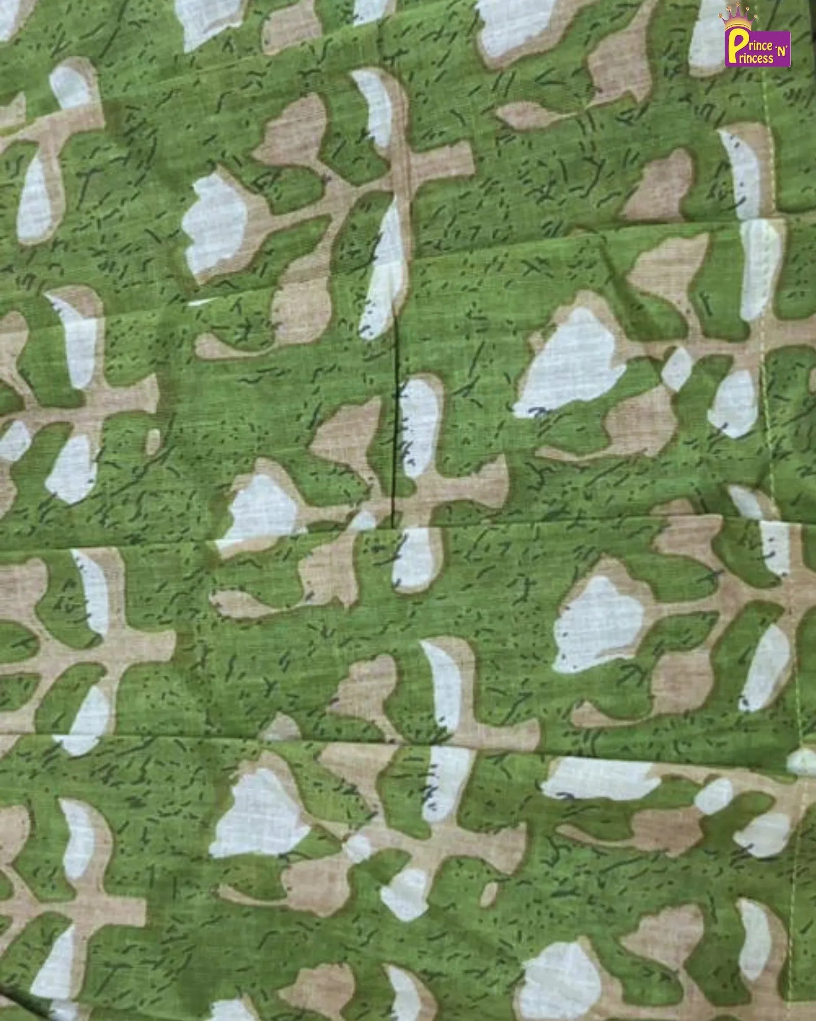 Textured fabric with green, brown, and white pattern