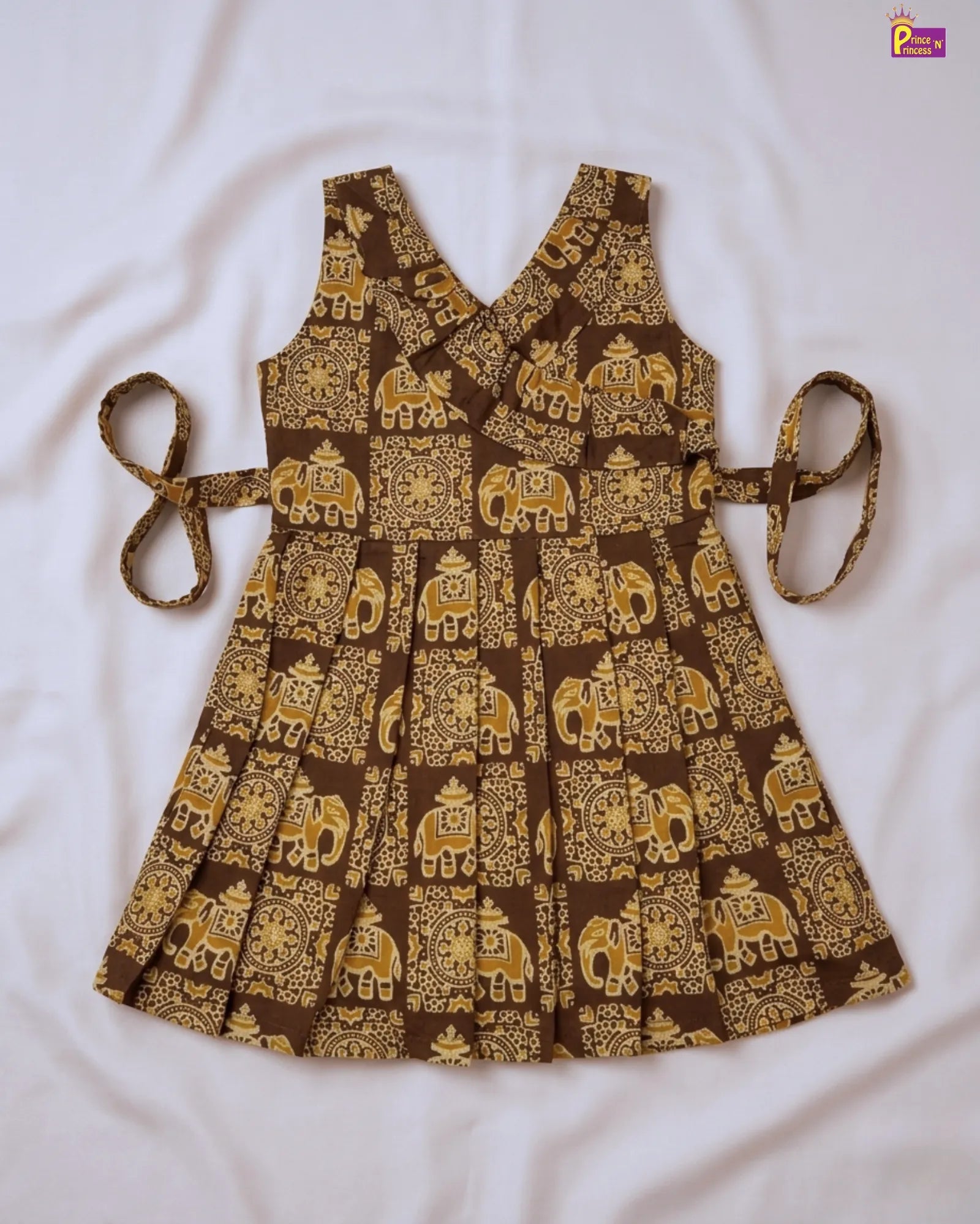 Brown apron with gold elephant pattern on a white background