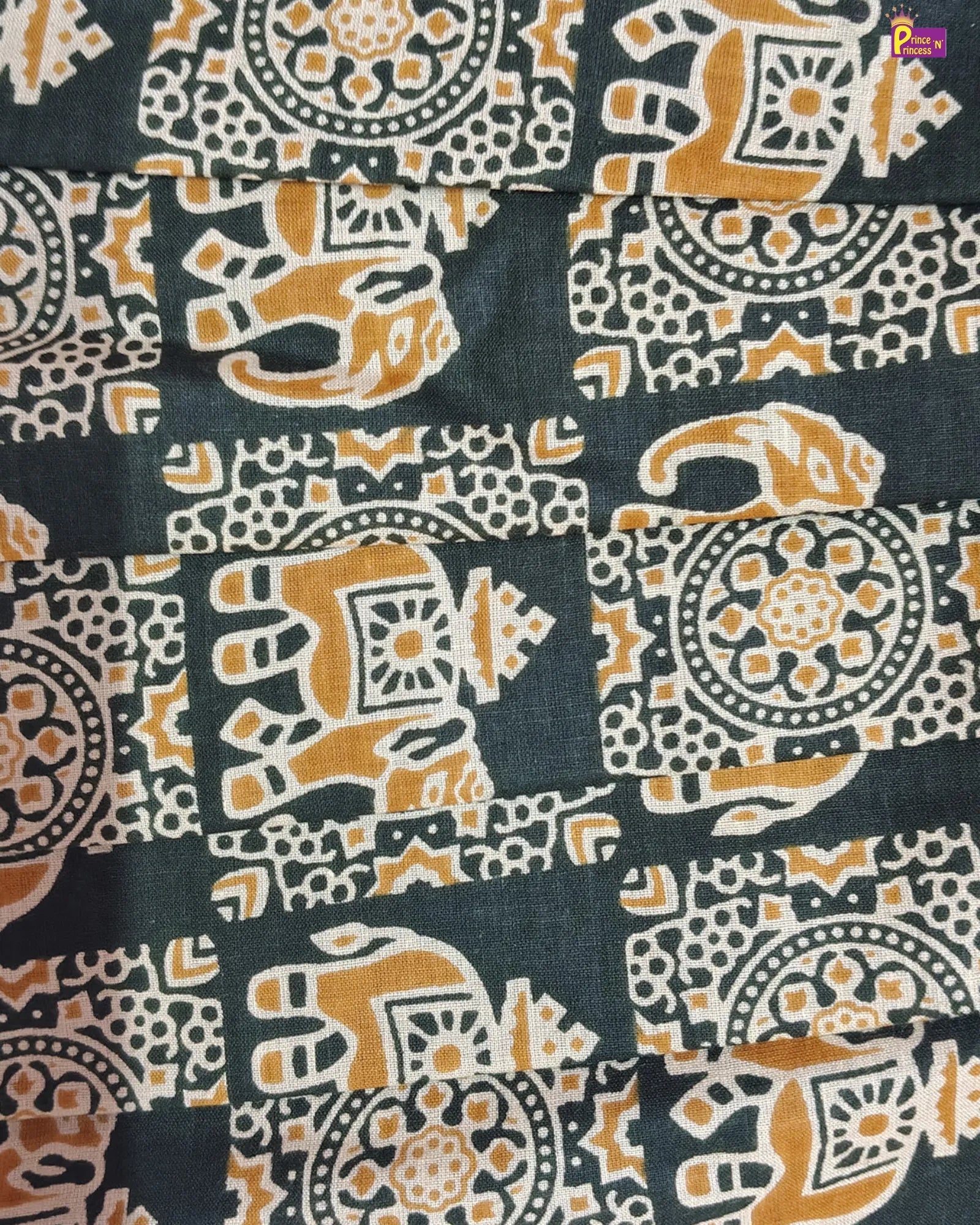 Patterned fabric with elephants and geometric shapes on a dark background